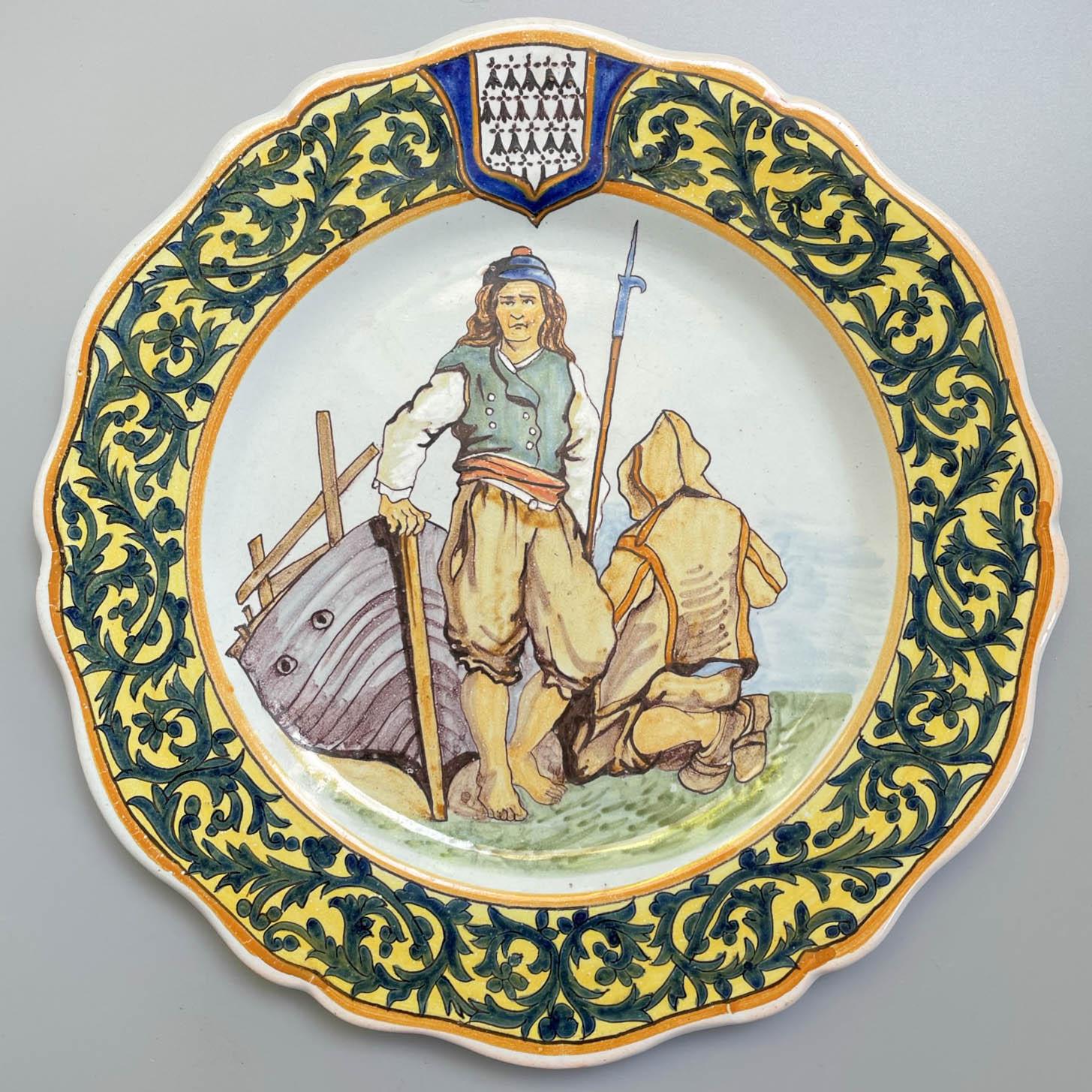 A 19th century French Porquier Beau Quimper faience plate with fisherman scene. Foliate border with Brittany coat of arms. Good details. Small chips to glaze on back rim. Signed verso: PB Guissény. Minor wear. Circa 1895-1900.
Dimensions:  9.25