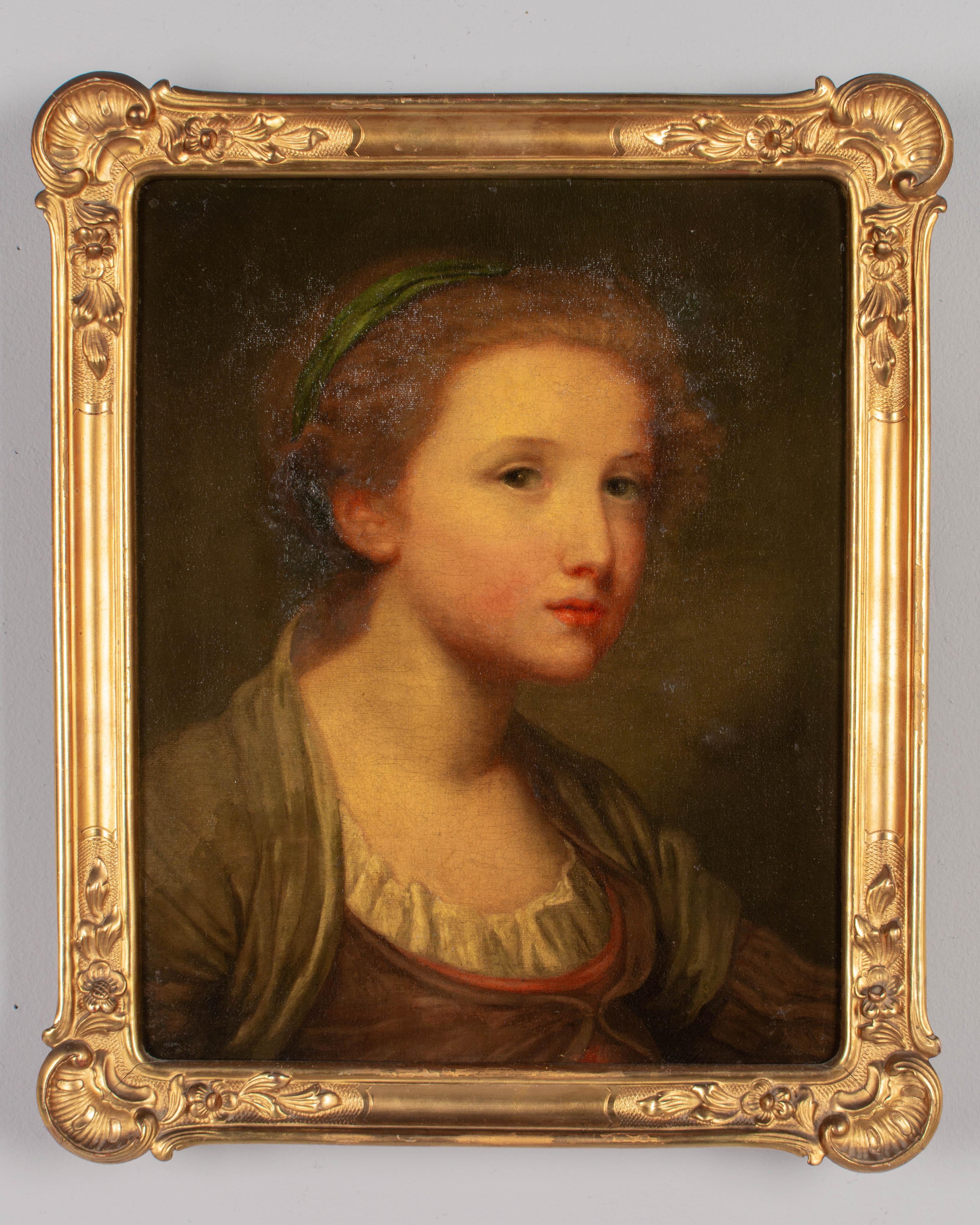 Portrait d'une jeune fille du XIXe siècle attribué à l'artiste français Jean-Baptiste Greuze (1725-1805). Huile sur toile. Non signé, peut-être un exemplaire de jeunesse de ce peintre prolifique connu pour ses charmants portraits. Dans un cadre