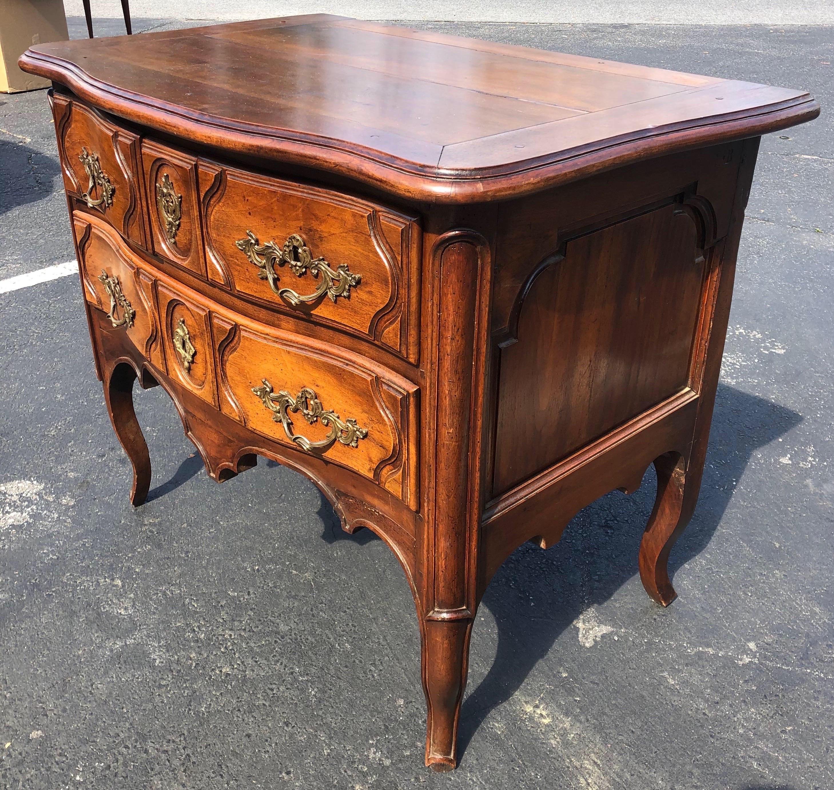 19th century French Provencial walnut 4-drawer commode. Three smaller drawers over one full drawer. Wonderful patina and the dimensions.