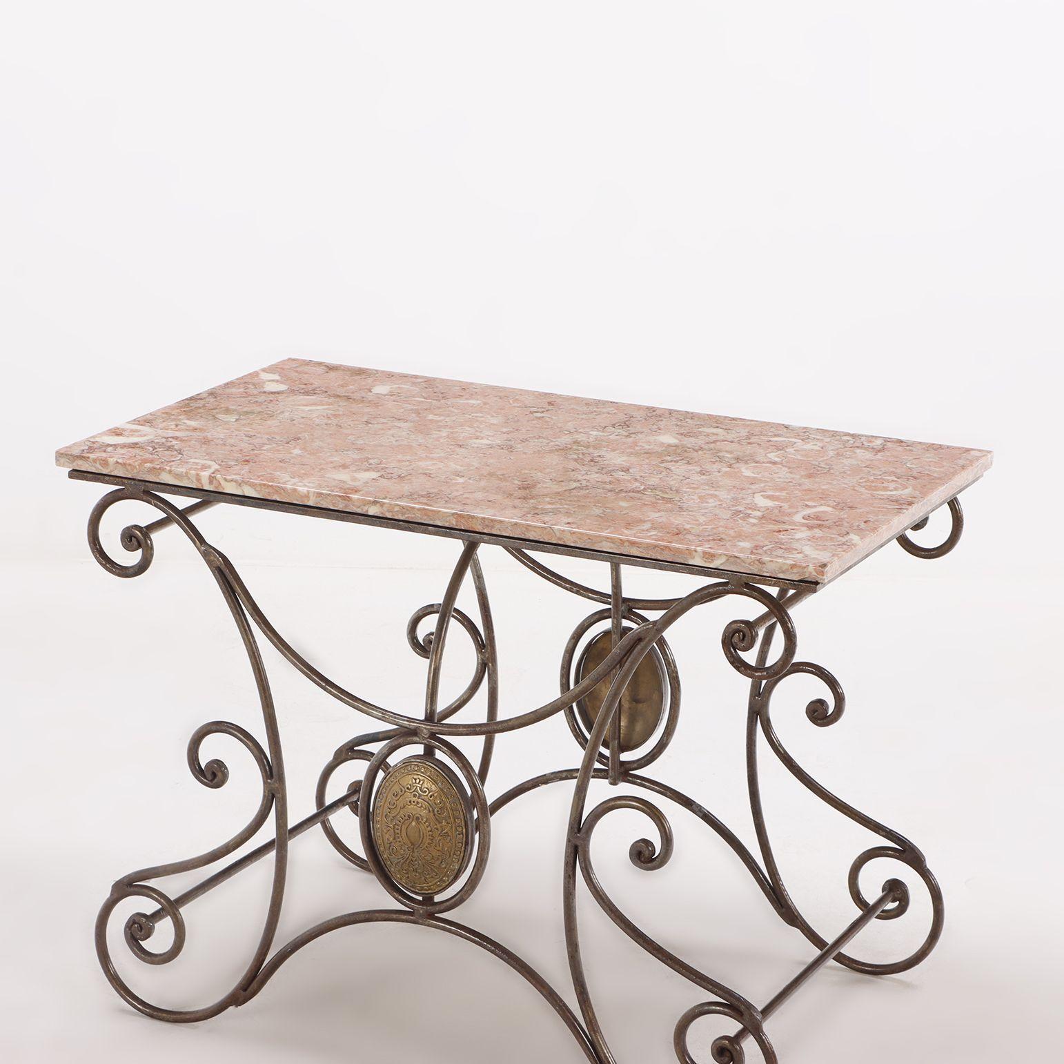 19th Century French Provincial Butchers Table. Made of decoratively scrolled steel legs with brass accents and the original marble top. Made in central France circa 1860.