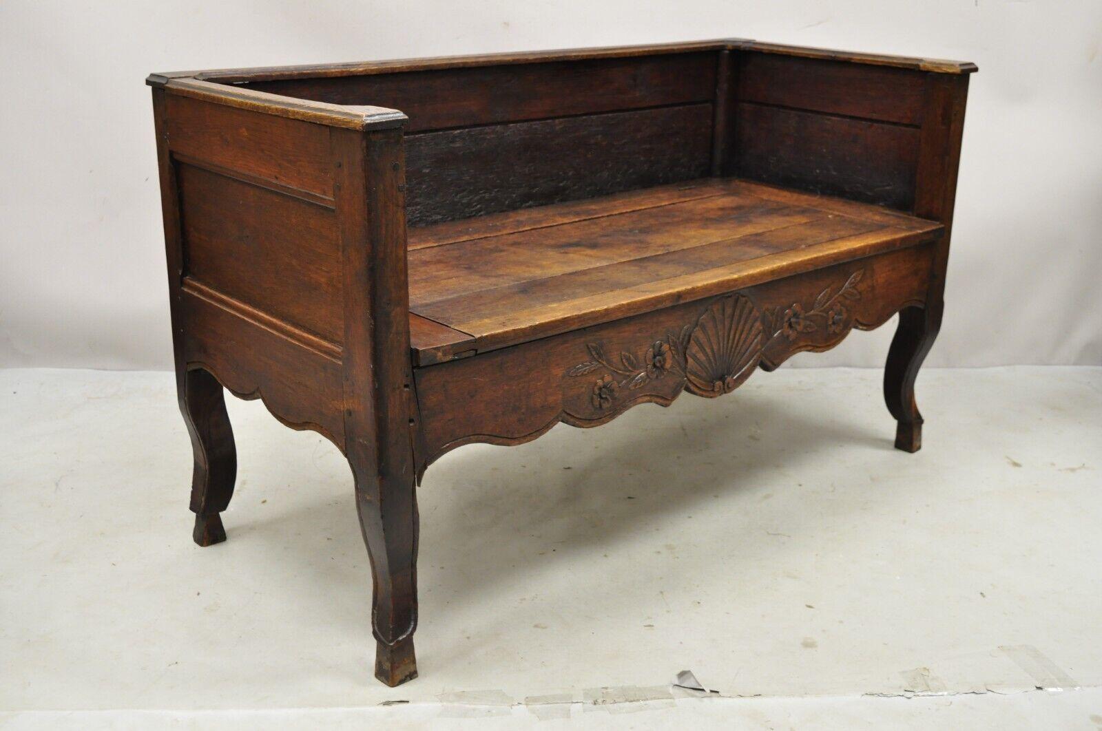 19th century French Provincial country walnut hoof foot storage window bench. Item featured has hoof feet, lift up lid with shallow storage, even arms, solid wood construction, beautiful wood grain, distressed finish, very nice antique item, quality