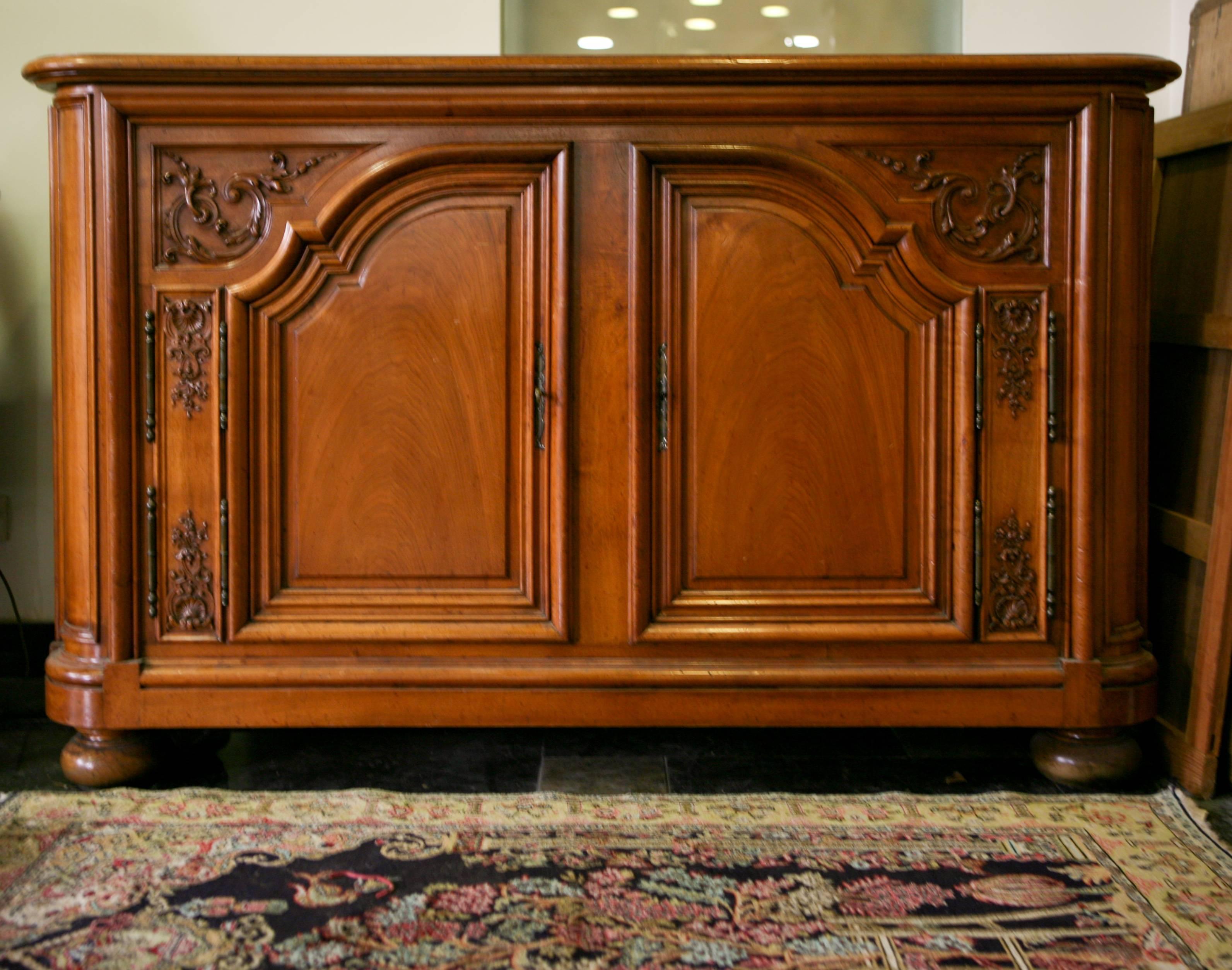 A 19th century French hand-carved two-door sideboard. The doors open to reveal two adjustable shelves for storage. Offered in excellent condition with two original working keys a good item for any traditional kitchen.
France, circa 1870.