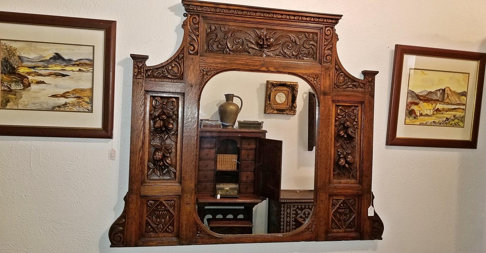 Really nice, highly carved French Provincial oak over-mantle mirror from circa 1880.

Carvings of vines, fruit and flowers with ‘Green Man” head as central motif.

Probably made in Northern France, in the Ardennes Region, it has a strong
