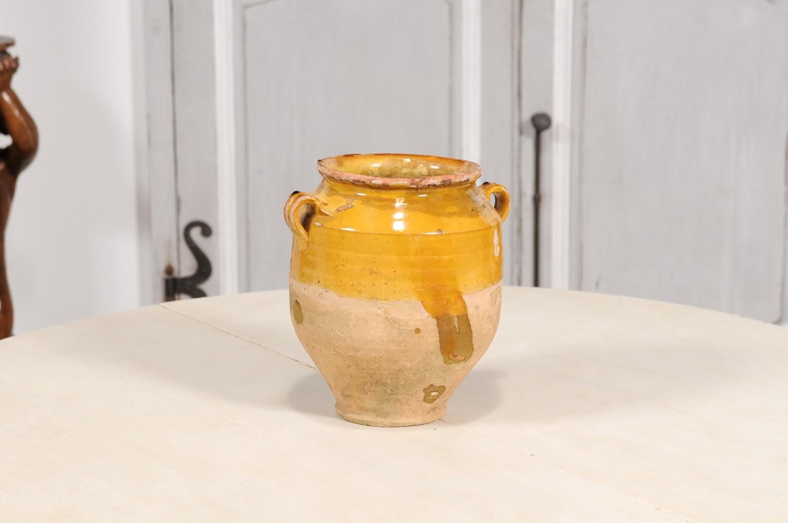 Glazed 19th Century French Provincial Rustic Pot à Confit with Yellow Glaze and Handles For Sale