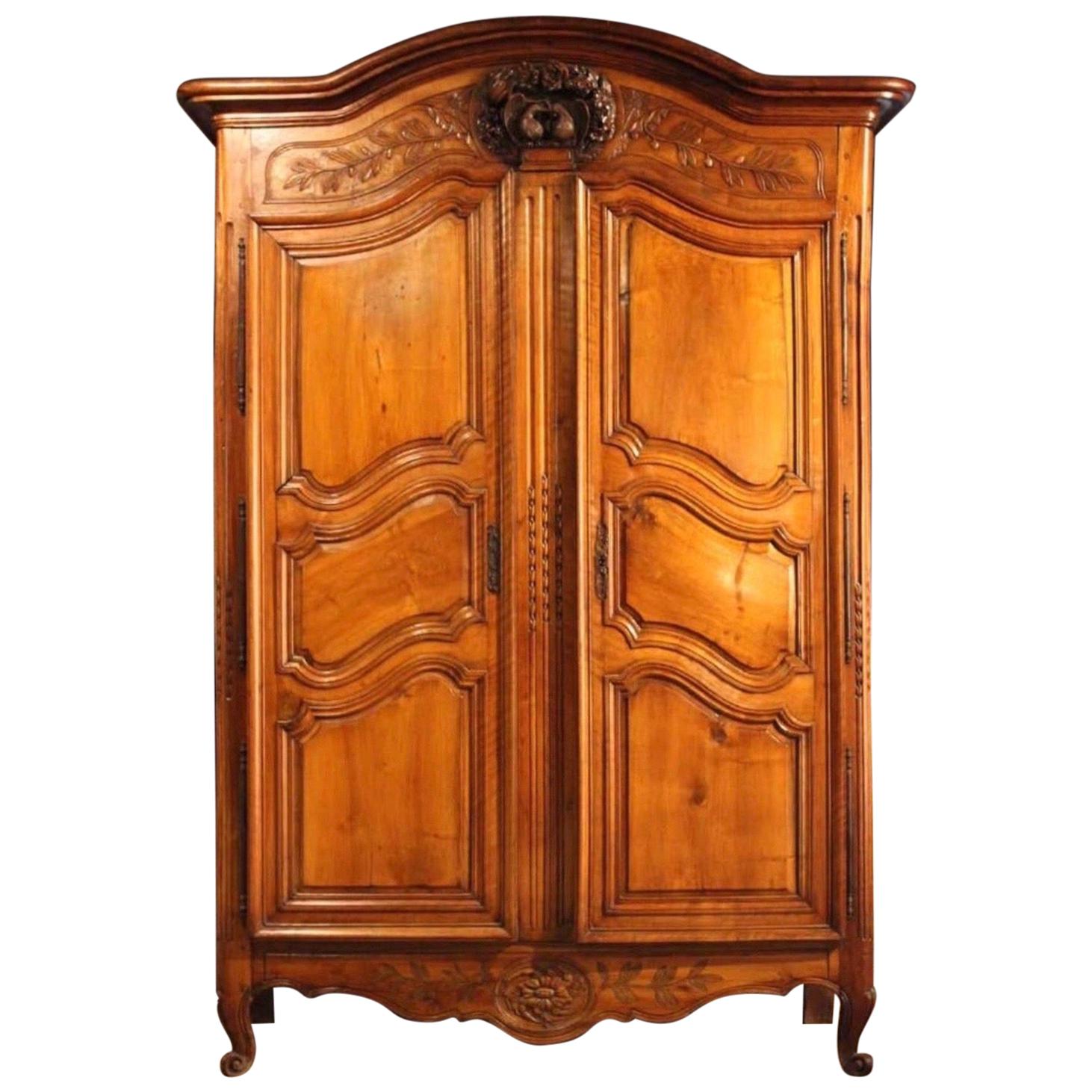 19th Century French Provincial Walnut and Cherryood Armoire with Carved Doves