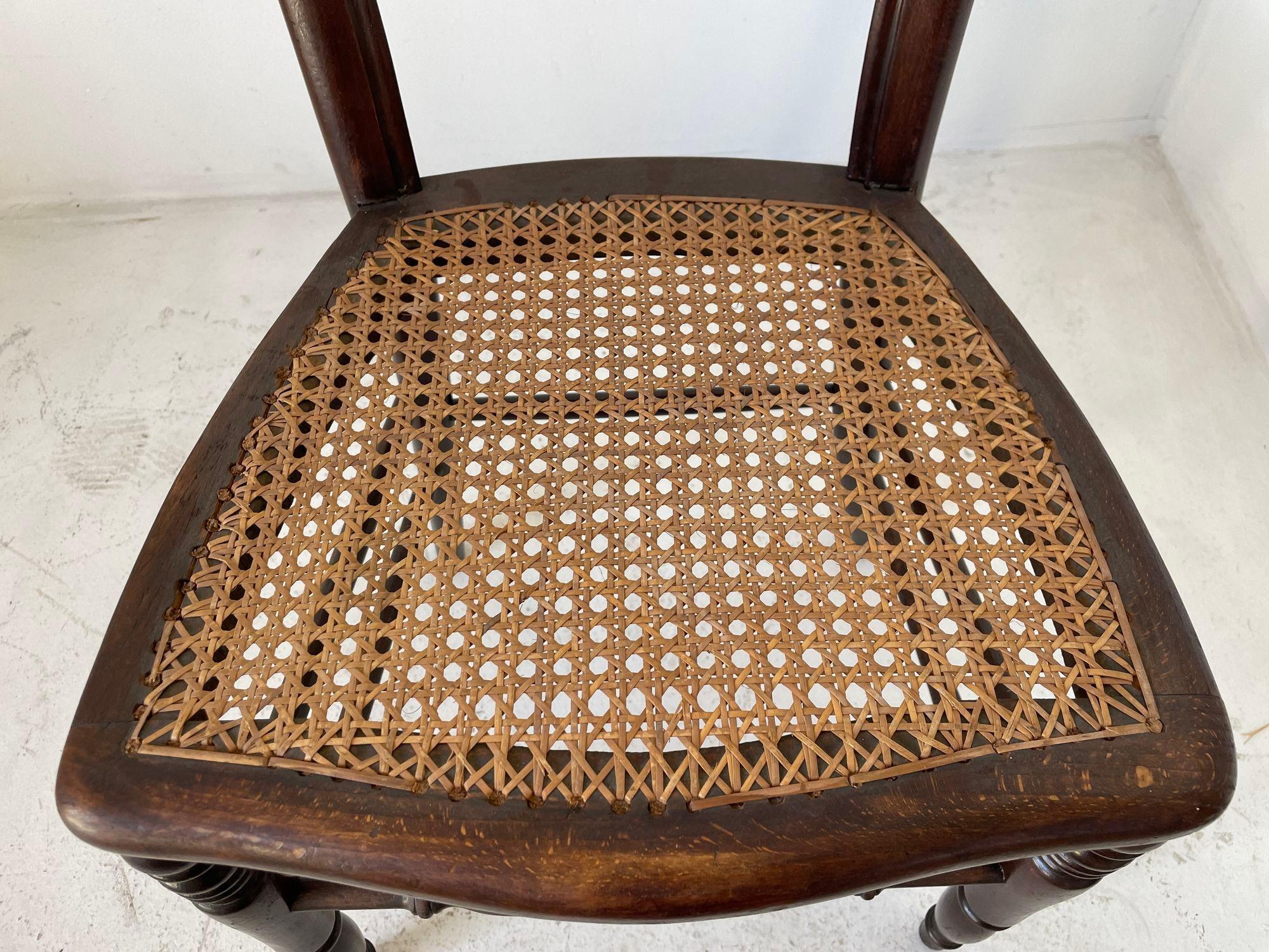 Antique 19th century French Provincial walnut side chair.
Antique French Country caned seat walnut chair.
Chair has a waisted balloon back with cabriole legs ending in scrolled French toes on pegs.
Wonderful side chair, great to use in a small