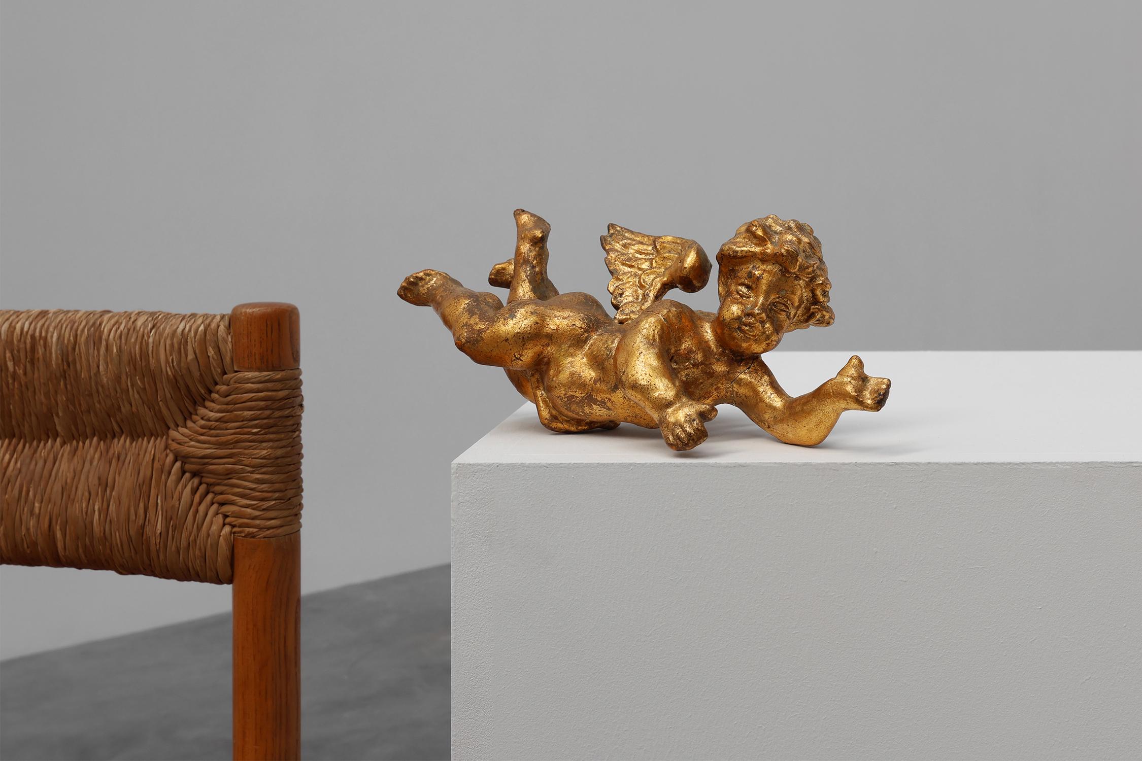 Hand-Carved 19th Century French putti in carved wood and gilded plaster For Sale