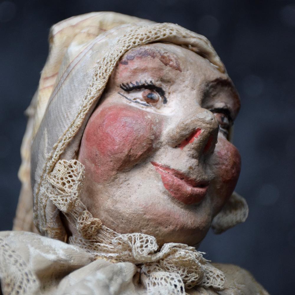 Quite simply an amazing mid-19th century museum quality puppet doll, handstitched silk puerto frill style clothing, velour boots, lace finishing and hand carved/painted wooden head. This example has a linen body and filler with straw. A wonderful