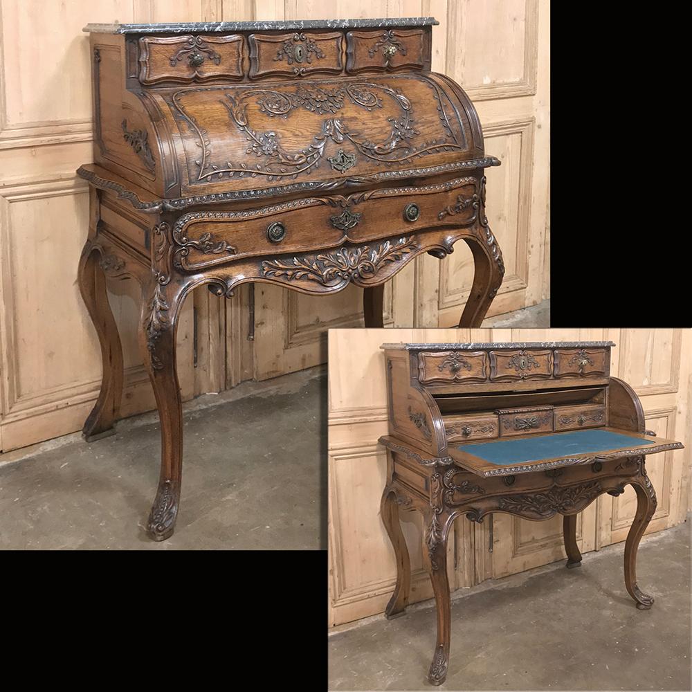 19th century French Regence roll top secretary is a relatively uncommon design when crafted by French artisans, and this example exudes impeccable quality! A drawer tier appears above the exquisitely carved cylindrical desk cover which rolls back to