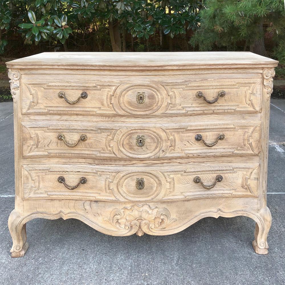 19th century French Regence stripped commode was handcrafted from beautifully grained white oak and left in its natural color making it a perfect choice for today's lighter decors! Subtle bowed Front design with carved cornerposts and elaborately