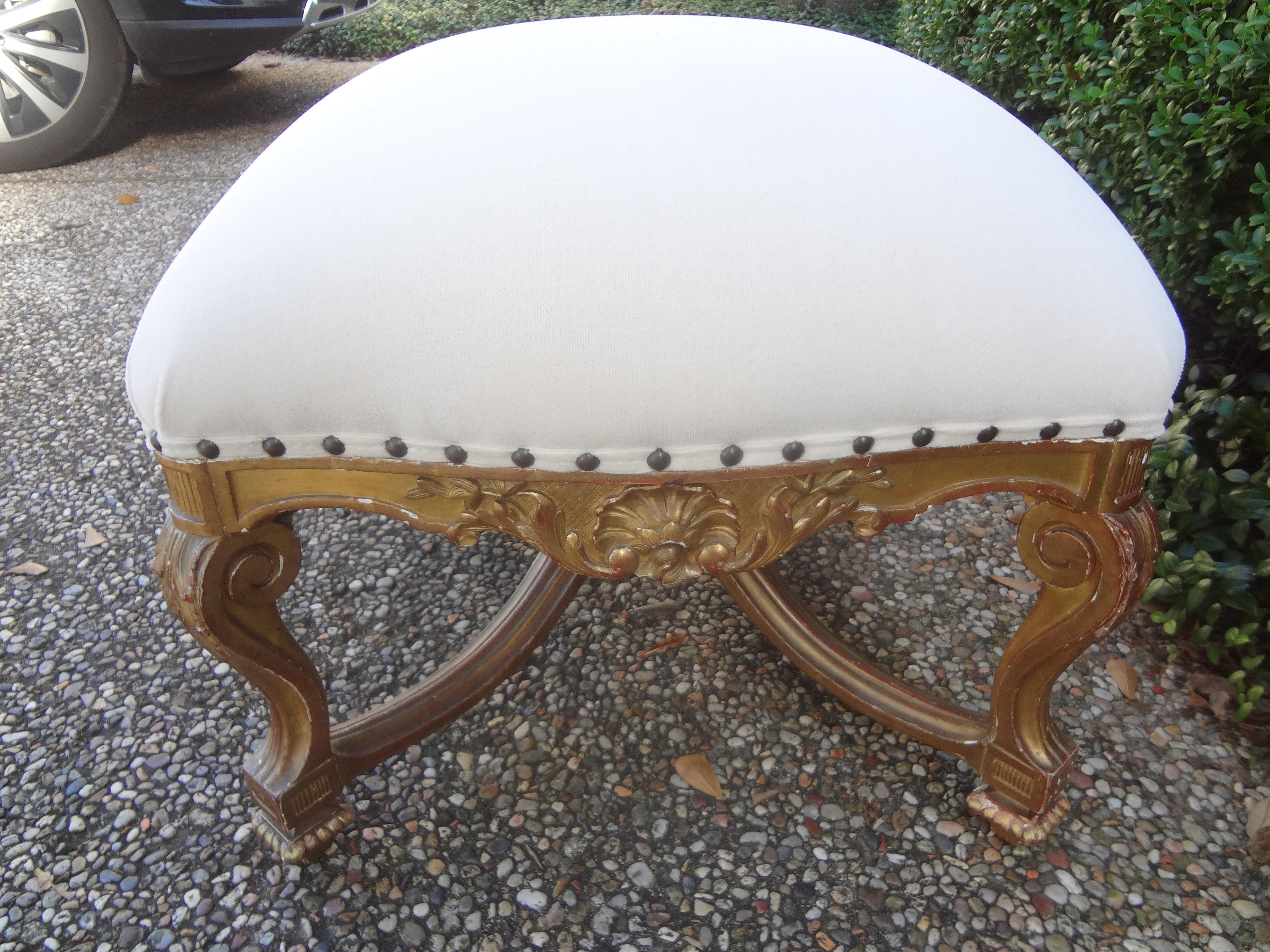 19th century French Regence style giltwood bench.
Stunning 19th century French Regence style giltwood bench, ottoman, stool or tabouret. Our beautiful antique French gilt wood bench was taken down to the frame and professionally upholstered in cream