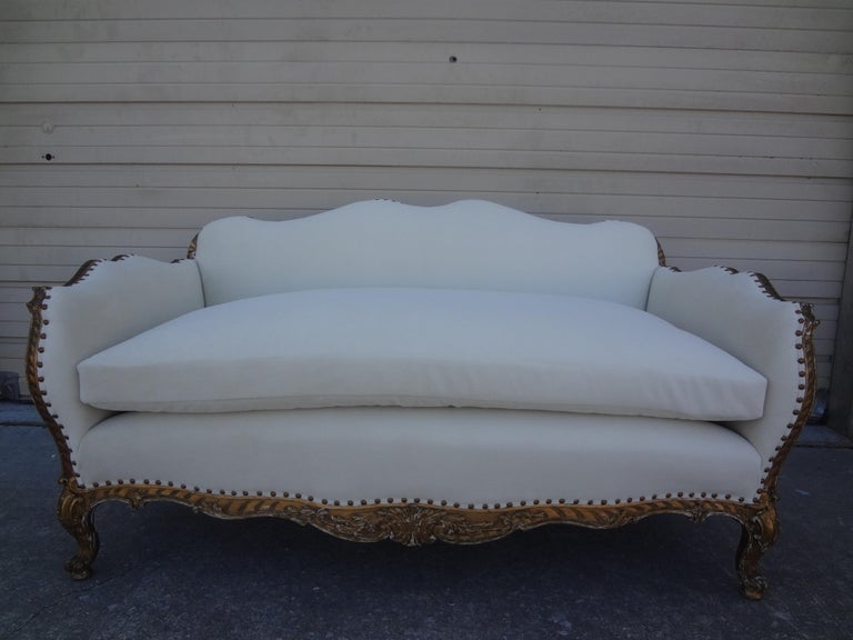19th century French Régence Style Giltwood loveseat or sofa. This Stunning Most Unusual Antique French Régence Style Or Napoleon III Giltwood Loveseat, Canape Or Sofa Has Been Professionally Upholstered In A Plush White Low Pile Mohair Type Fabric.