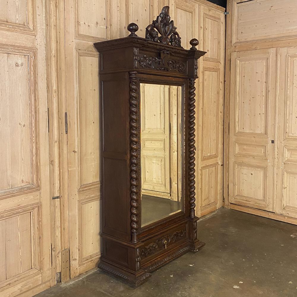 19th century French Renaissance Barley twist armoire was crafted by master artisans from solid, old-growth indigenous oak during the Napoleon III Period, when craftsmanship reached a plateau of quality recognized the world over! The amazing heraldic