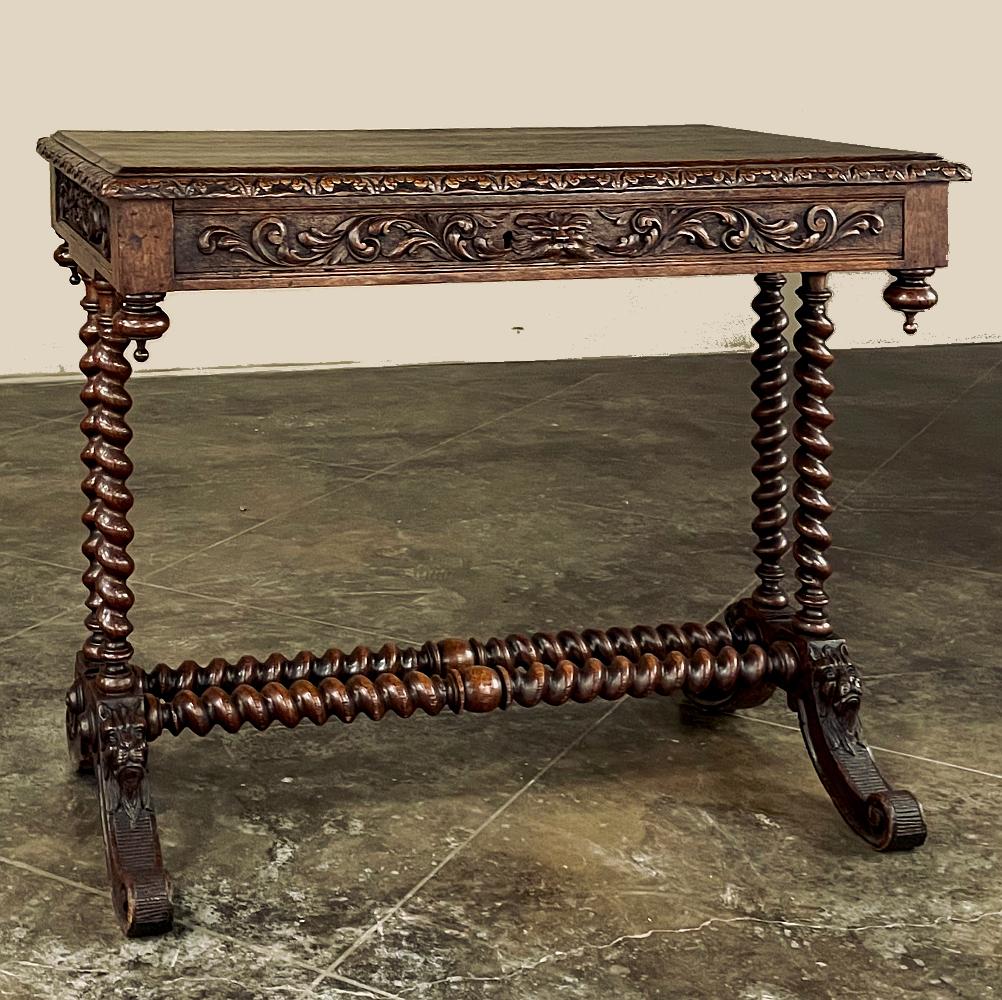 19th Century French Renaissance Barley Twist Writing Table makes the perfect choice for a student desk, a family room, or a library!  Hand-crafted from dense, old-growth oak, it features clockwise & counter-clockwise barley twist columns in a