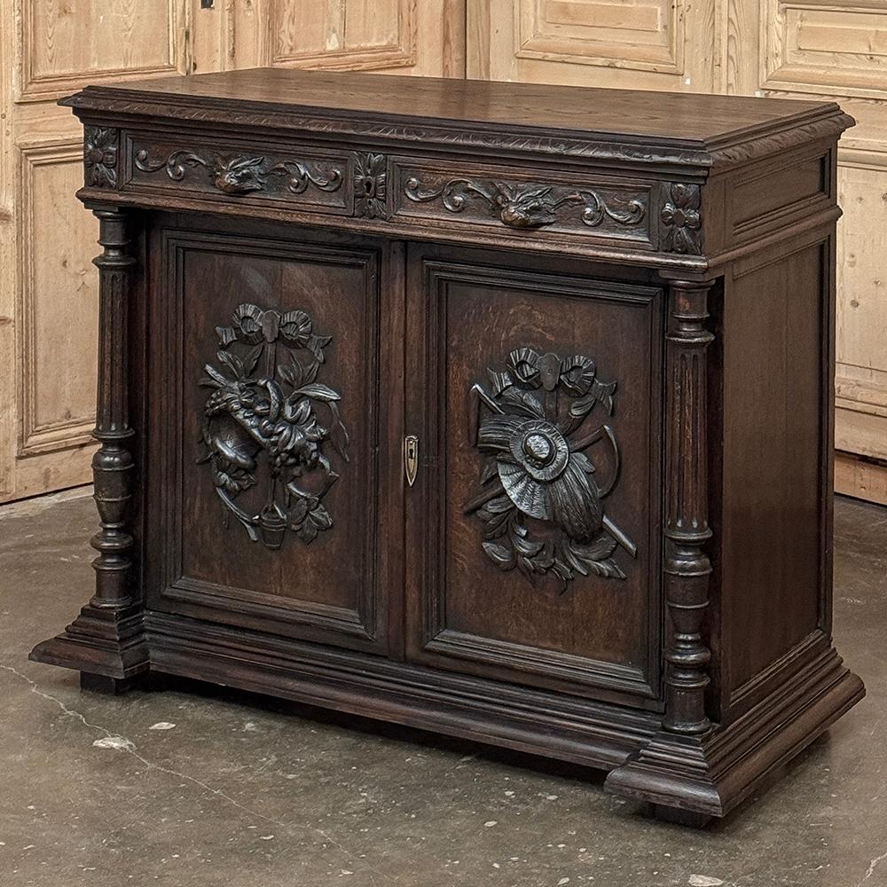 19th Century French Renaissance Buffet is ideal for the Old World decor!  Hand-crafted and carved from old-growth oak, it features a rugged, intricate design including carved edging all around the plank top and completely dominating the facade.  A