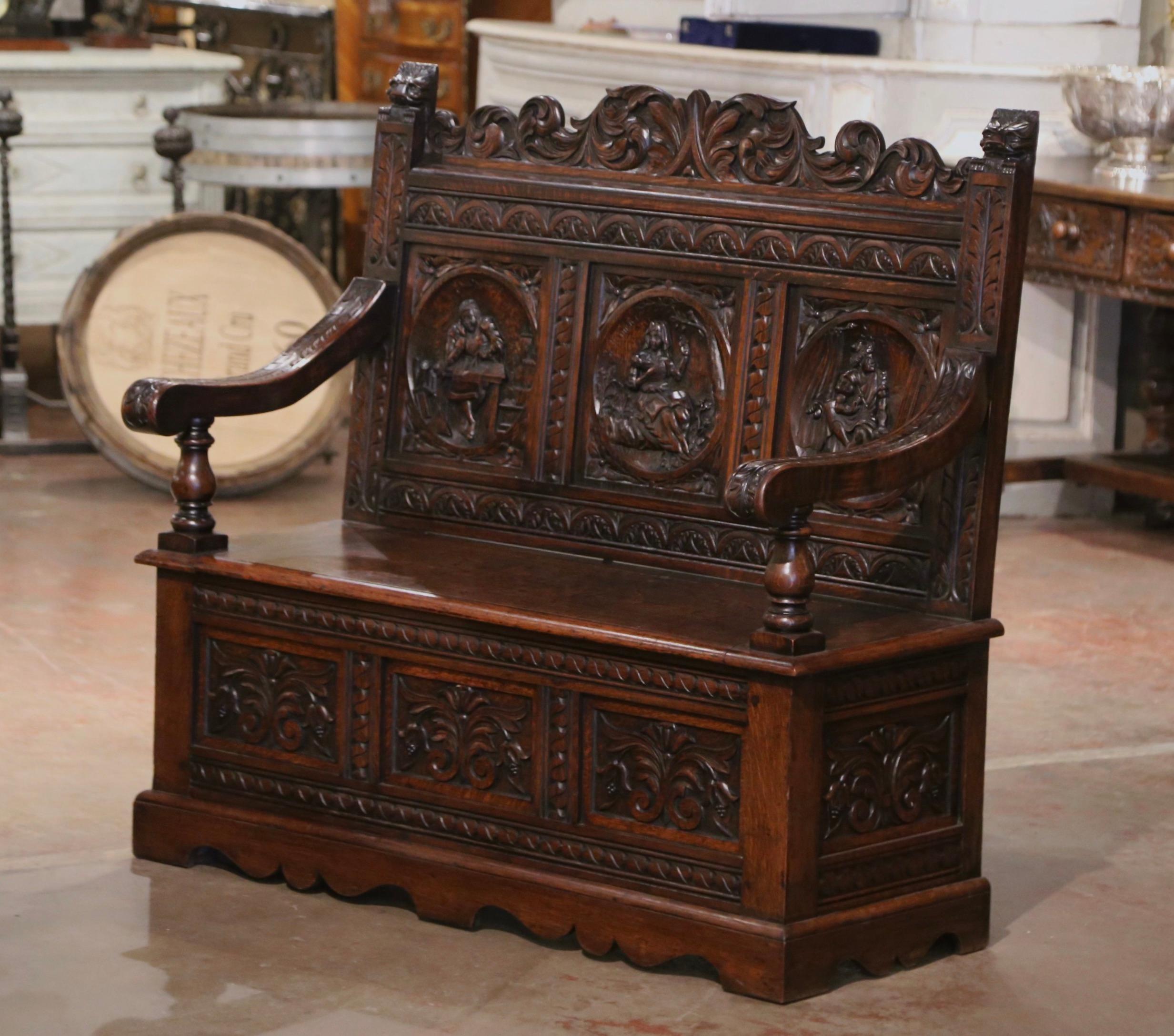 Compliment your entryway, hallway or mud room with this heavily carved antique bench. Crafted in northern France, circa 1870, and built of solid oak wood, the Renaissance style bench stands on bracket feet over a carved scalloped apron. The elegant