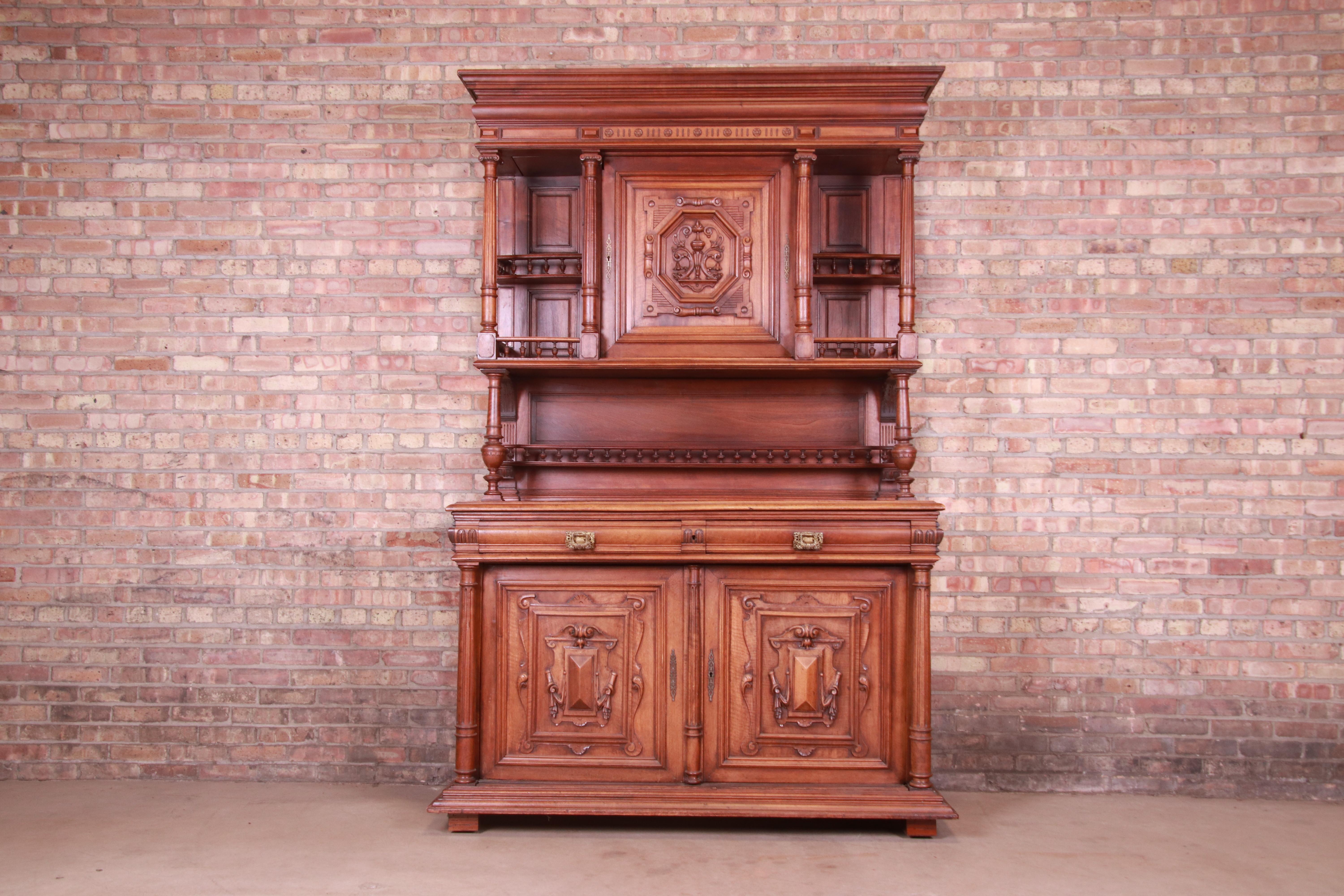 A gorgeous antique French Renaissance Henri II sideboard hutch or bar cabinet

France, Late 19th Century

Carved walnut, with original brass hardware.

Measures: 62