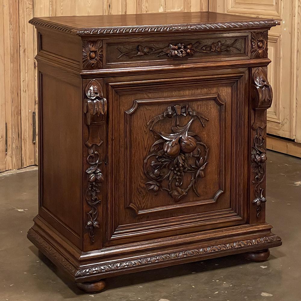 19th Century French Renaissance Confiturier ~ cabinet displays an abundance of artful splendor in a relatively diminutive package! Rendered from old-growth indigenous oak, it features a gadrooned top that wraps around the facade just as the