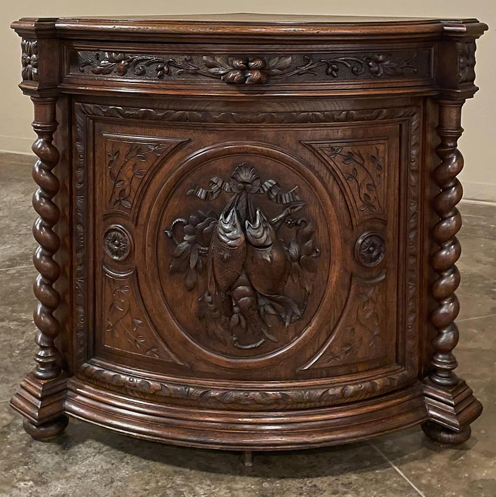 19th century French Renaissance Corner Cabinet represents the epitome of the revival of the Renaissance style that occurred during the middle of the 1800s. Sculpted from solid oak by very talented cabinetmakers, it features a quarter of a pie shape