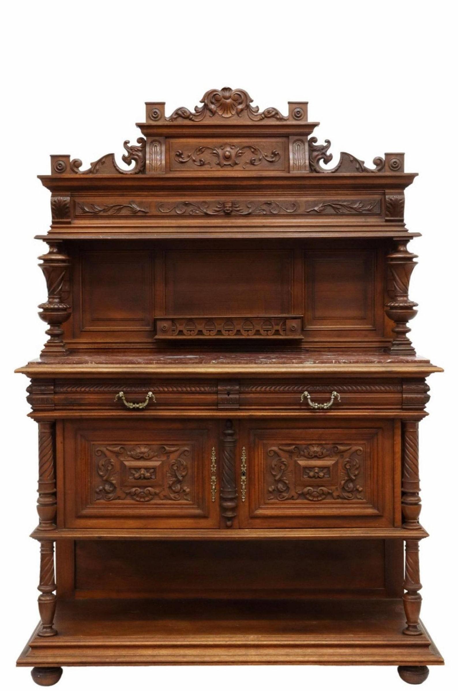 A most impressive antique, circa 1880, French carved walnut marble-top top buffet- sideboard server with nicely aged patina. 

Born in France during the late 19th century Renaissance Revival, hand-crafted of warm, rich solid walnut, exceptionally