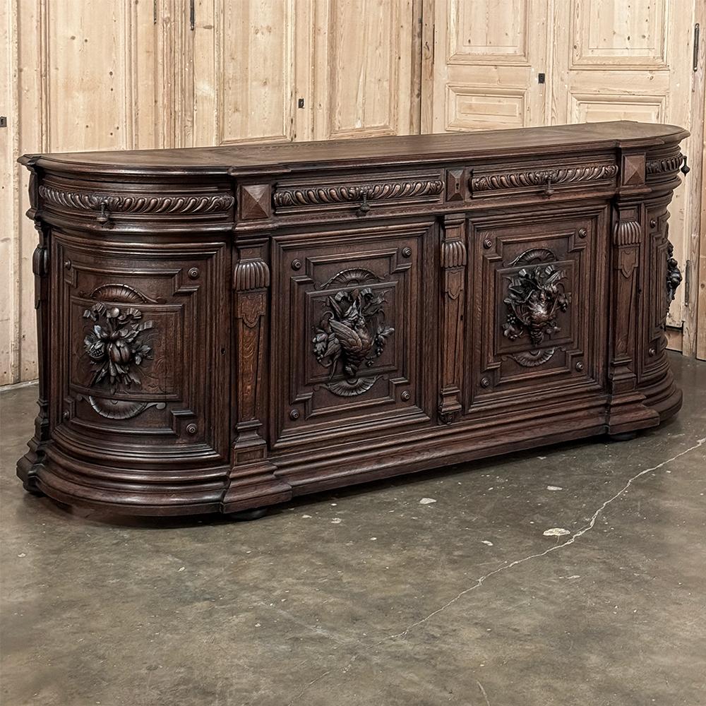 19th Century French Renaissance Hunt Buffet is a magnificent example of the breed, stretching seven and a half feet wide but with rounded sides to minimize its impact on your floor plan.  Crafted from hand-select, dense, old-growth oak, it features