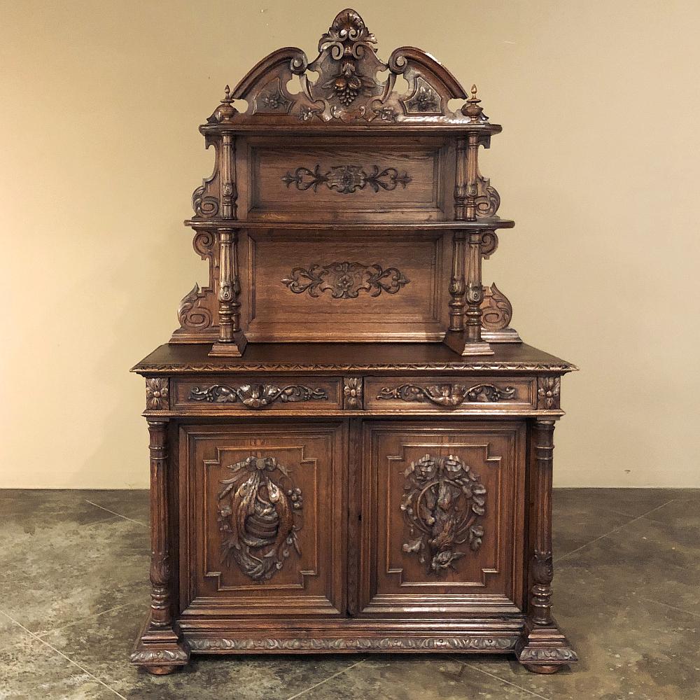 19th Century French Renaissance Hunt Vaisselier Buffet was artistically sculpted to celebrate the bounty of the earth, and perform a display, serving and storage function in the bargain! The heraldic crest reigns atop the scrolled crown, embellished
