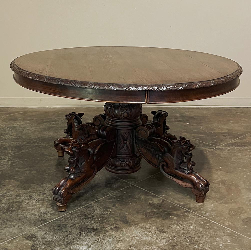 19th century French Renaissance oval center table was designed to captivate one's attention in a gracious home's entryway. Perfect as a small dining or game table, as well, it was fashioned from dense, old-growth oak and features demilune gadrooning