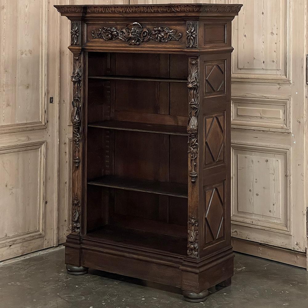 19th Century French Renaissance Petit Open Bookcase is a remarkable example of the later Renaissance Revival masterworks that were produced by French craftsmen during turbulent political times.  Designed on a much smaller scale than is typically