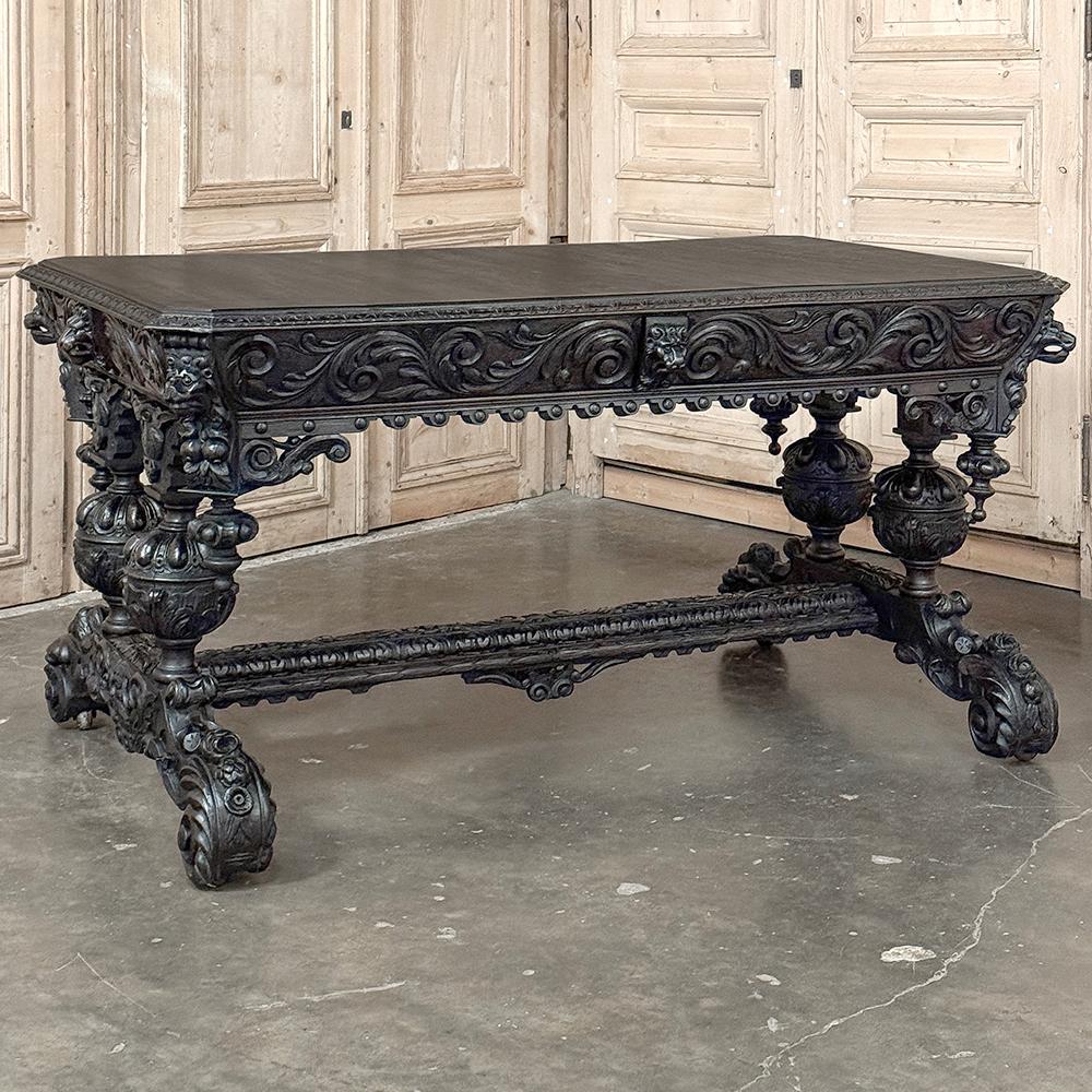 19th Century French Renaissance Revival Desk is a magnificent example of master cabinetmaking by French artisans from the 1850s to the end of the century.  Utilizing hand-select old-growth oak, the artisans fashioned a solid plank top with mitered