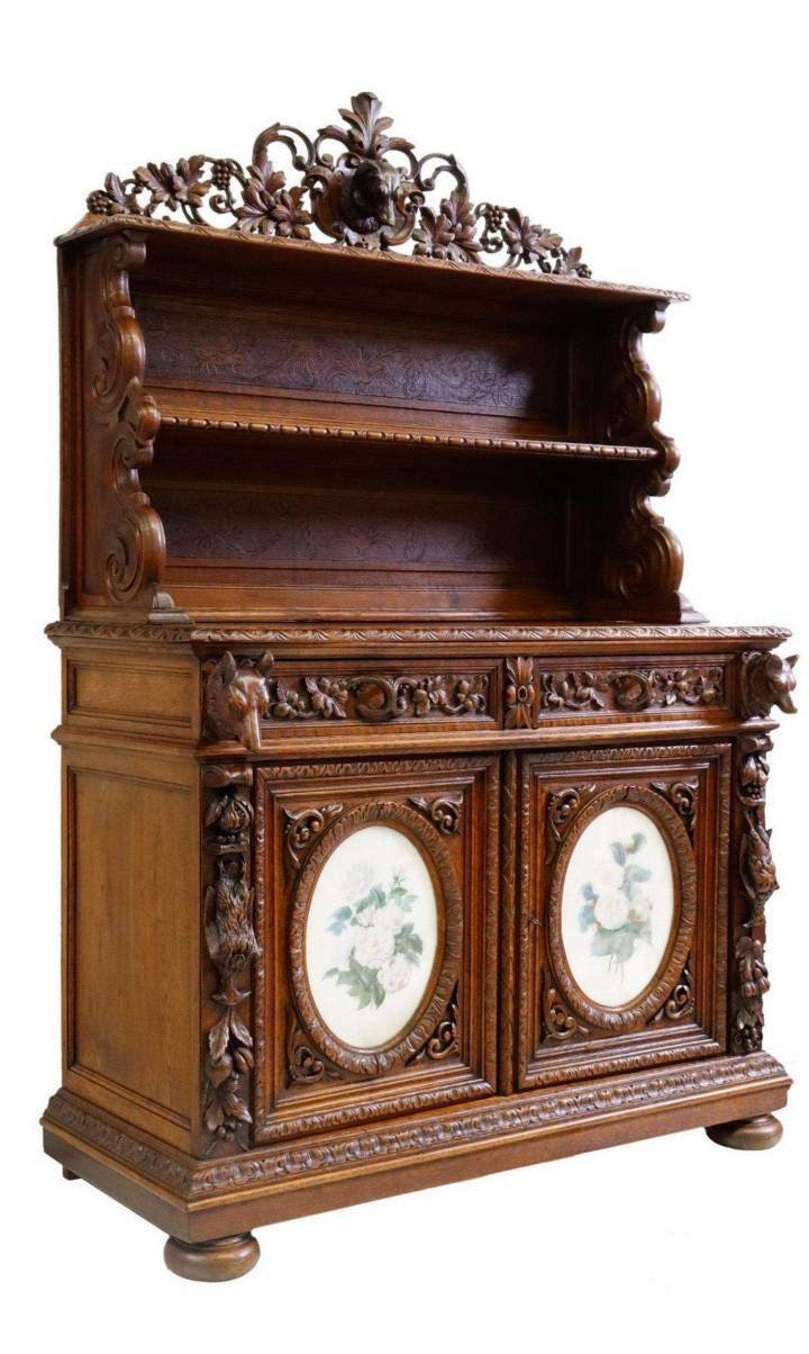 A magnificent antique French Renaissance Revival hunt sideboard, signed, circa 1854.

Exquisitely hand-crafted in France in the mid-19th century, finely hand carved and sculpted solid oak with beautifully aged mellow warm patina, two-piece, the