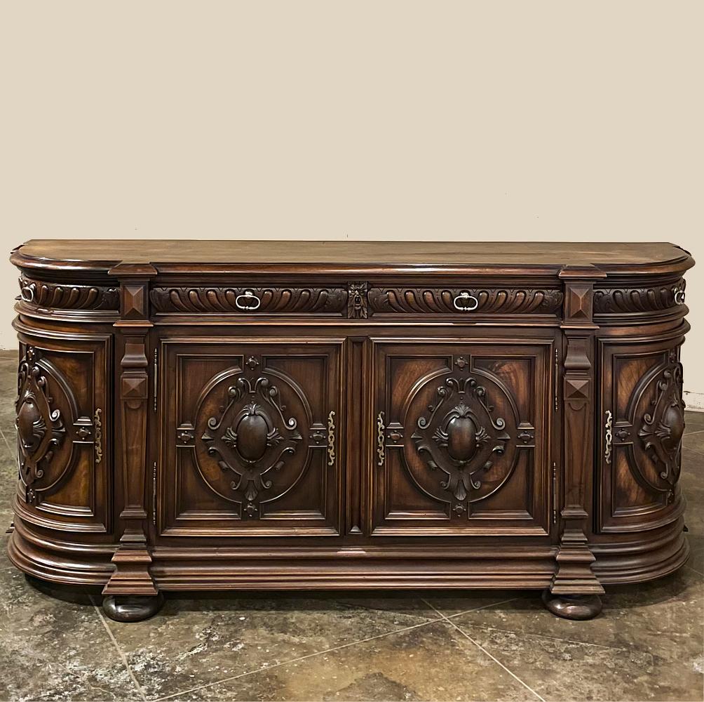 19th century French Renaissance Revival Walnut Buffet is a masterpiece of the artisans around the environs of Paris who strove to follow the trends set by the court, in this instance Napoleon III. Here we see the stylized, Italianate expression of