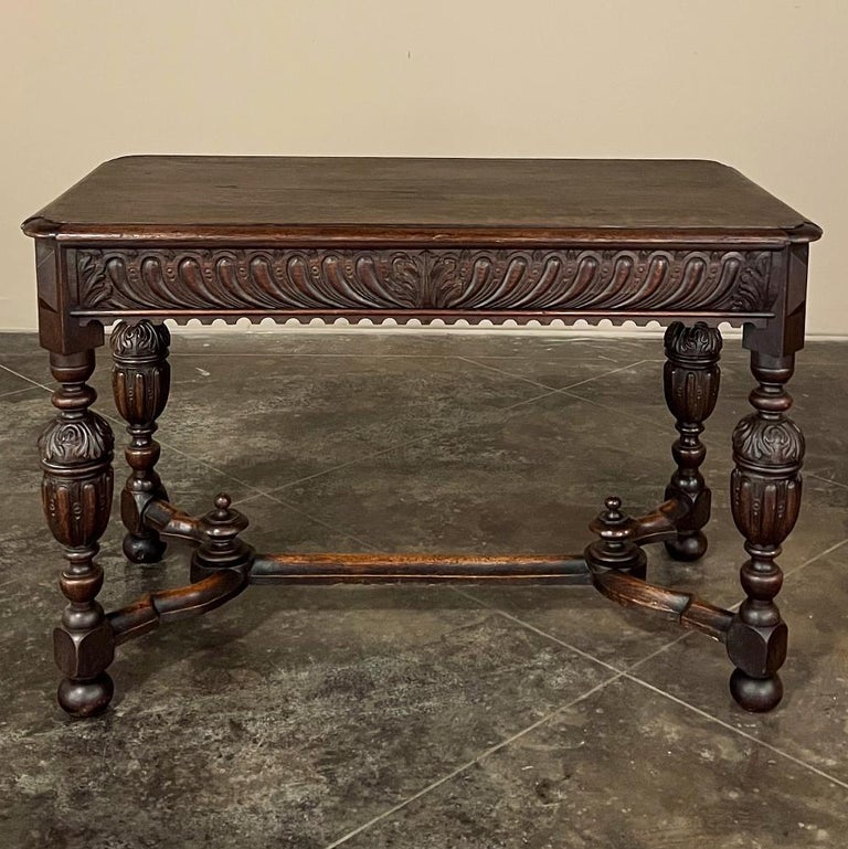 19th Century French Renaissance Sofa Table is an unusual design, indeed!  Embellished and carved around all four sides, it features a beautifully sculpted apron which conceals two drawers on both short ends!  A drapery edging finishes out the apron