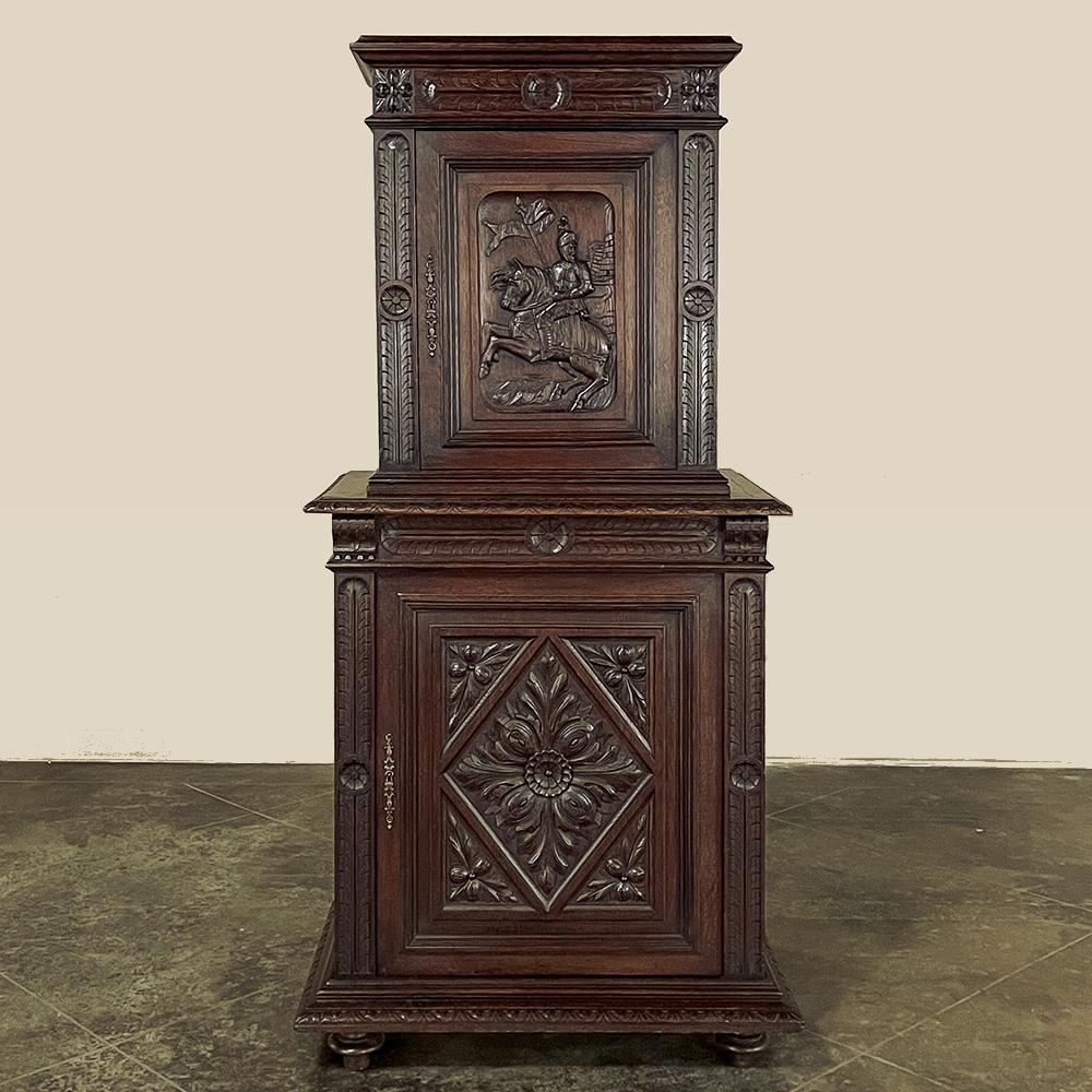 19th Century French Renaissance Two-Tiered Cabinet will make a handsome addition to your masculine decor.  Hand-crafted from solid oak, it features a neoclassic-inspired architecture with a top tier slightly smaller in footprint than the bottom