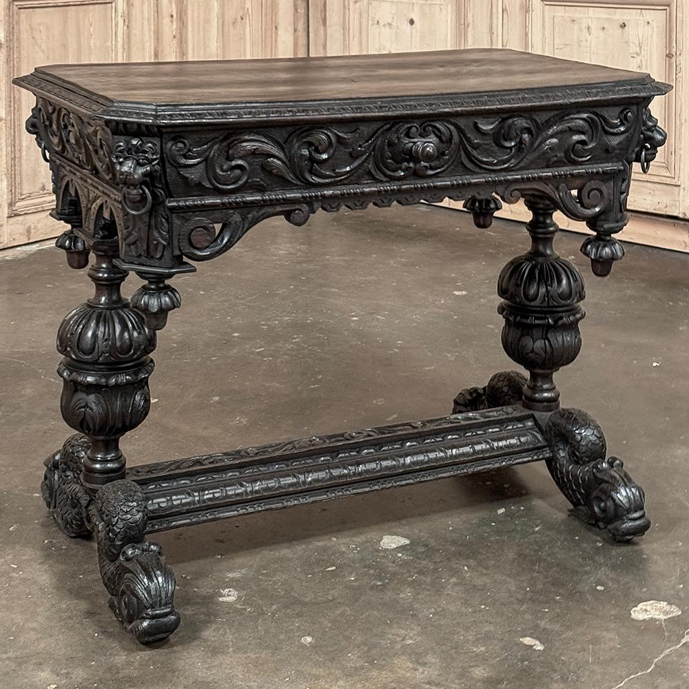 19th Century French Renaissance Writing Desk ~ End Table is a work of the sculptor's art, that also serves as a convenient student desk, writing table or library table.  Hand-carved from solid oak, it features a plank top with elaborately carved