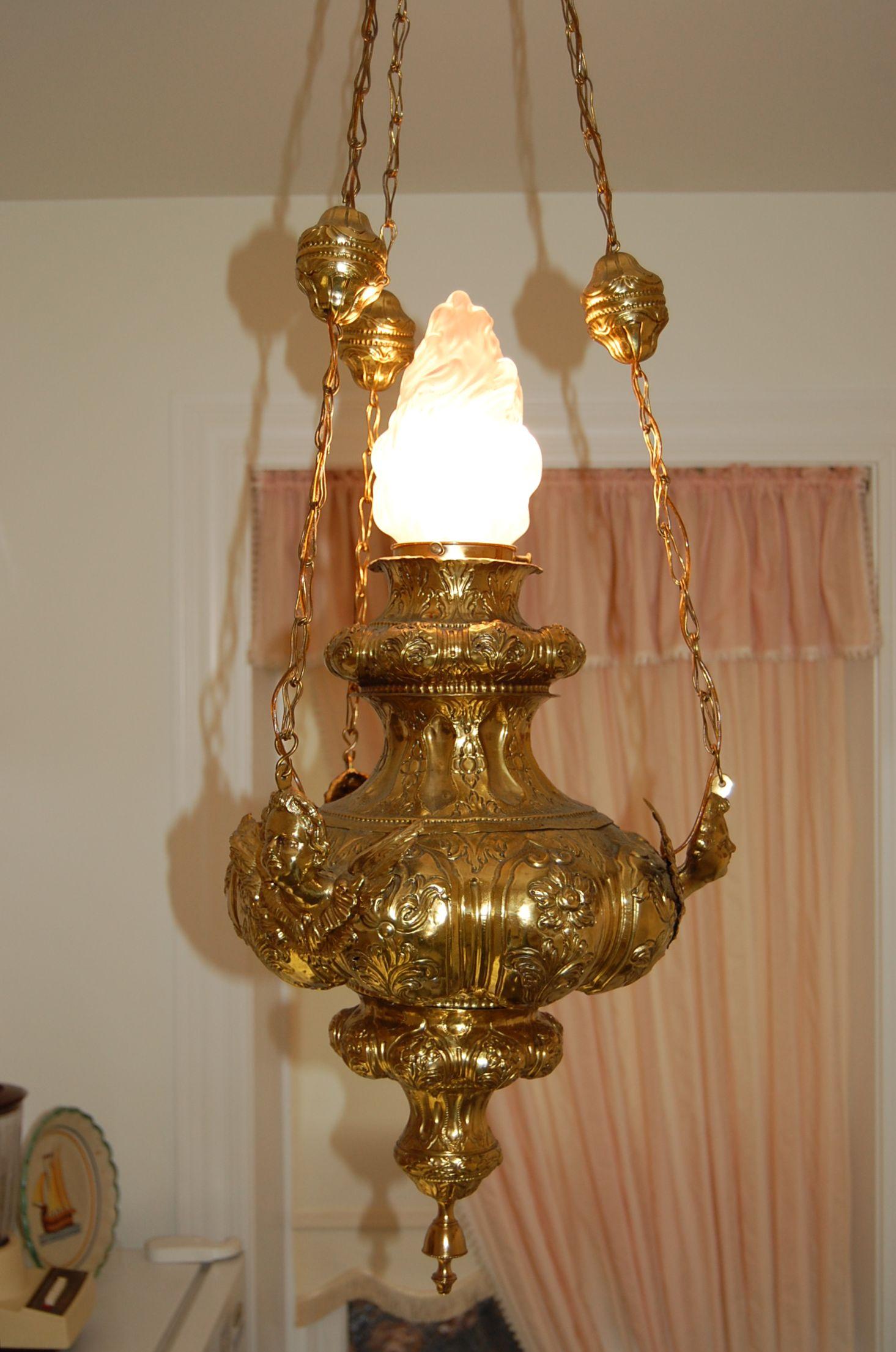 19th century Church Sanctuary lamp chandelier, a Repoussé brass circular hanging church lantern delicately decorated with three brass angels. Excellent condition with newer wiring, cleaned polished and lacquered. 48 inches long.