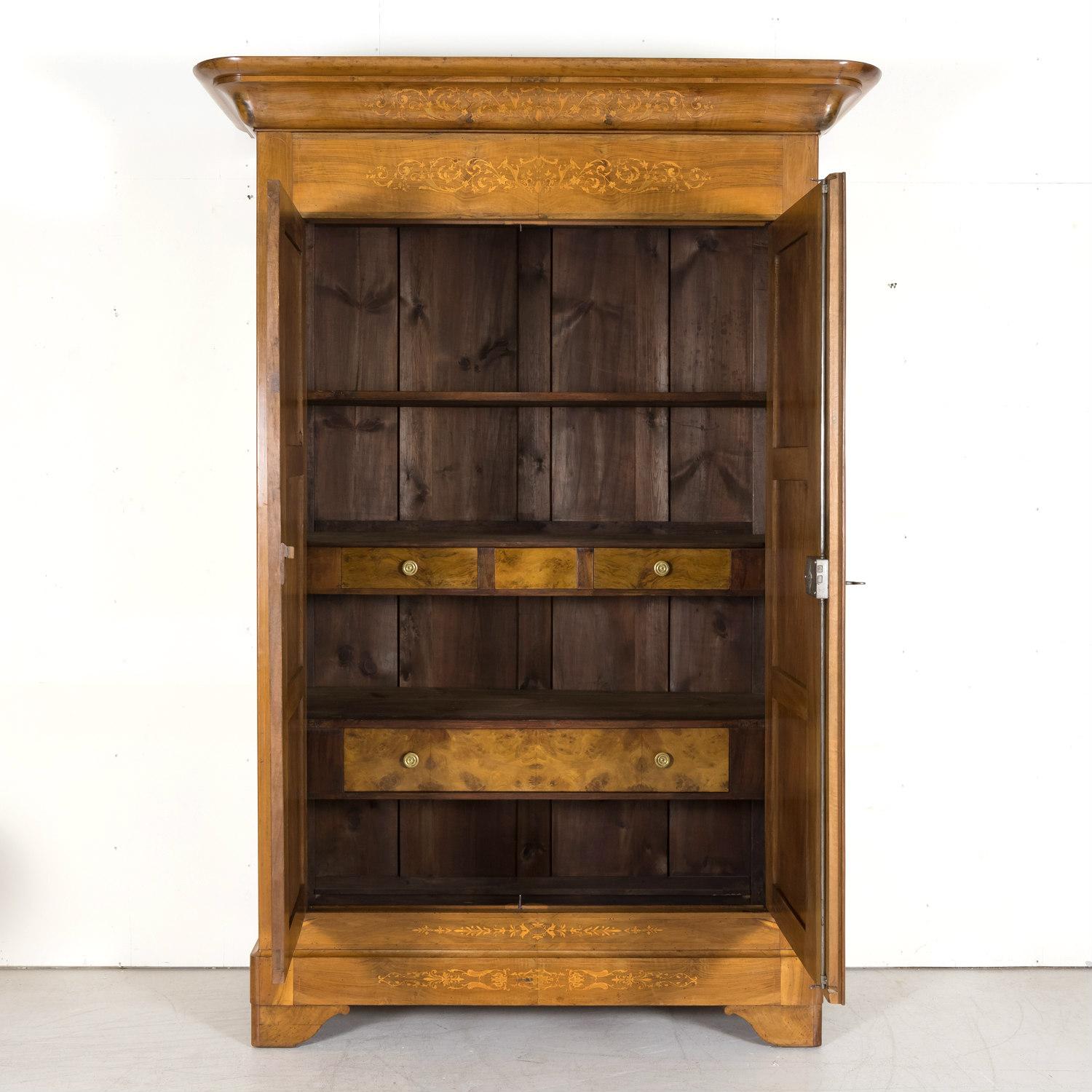 Early 19th Century 19th Century French Restauration Period Walnut Armoire with Fruitwood Marquetry For Sale