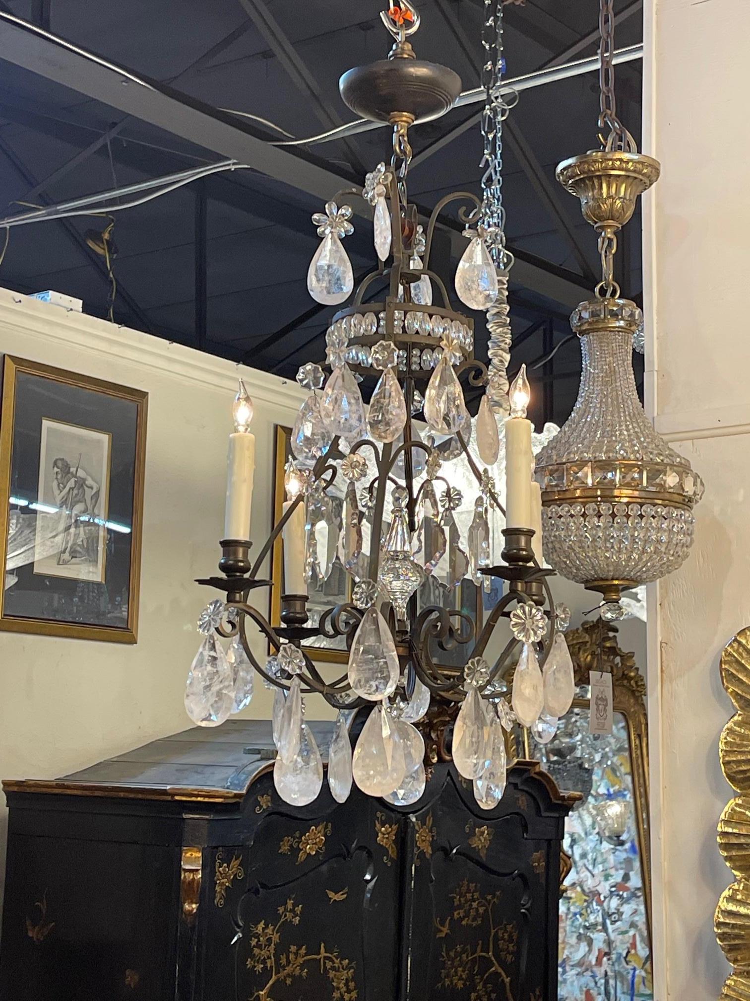 Gorgeous 19th century French rock crystal and bronze chandelier with 4 lights. Great scale and shape on this piece and it mixes well with a variety of decors!