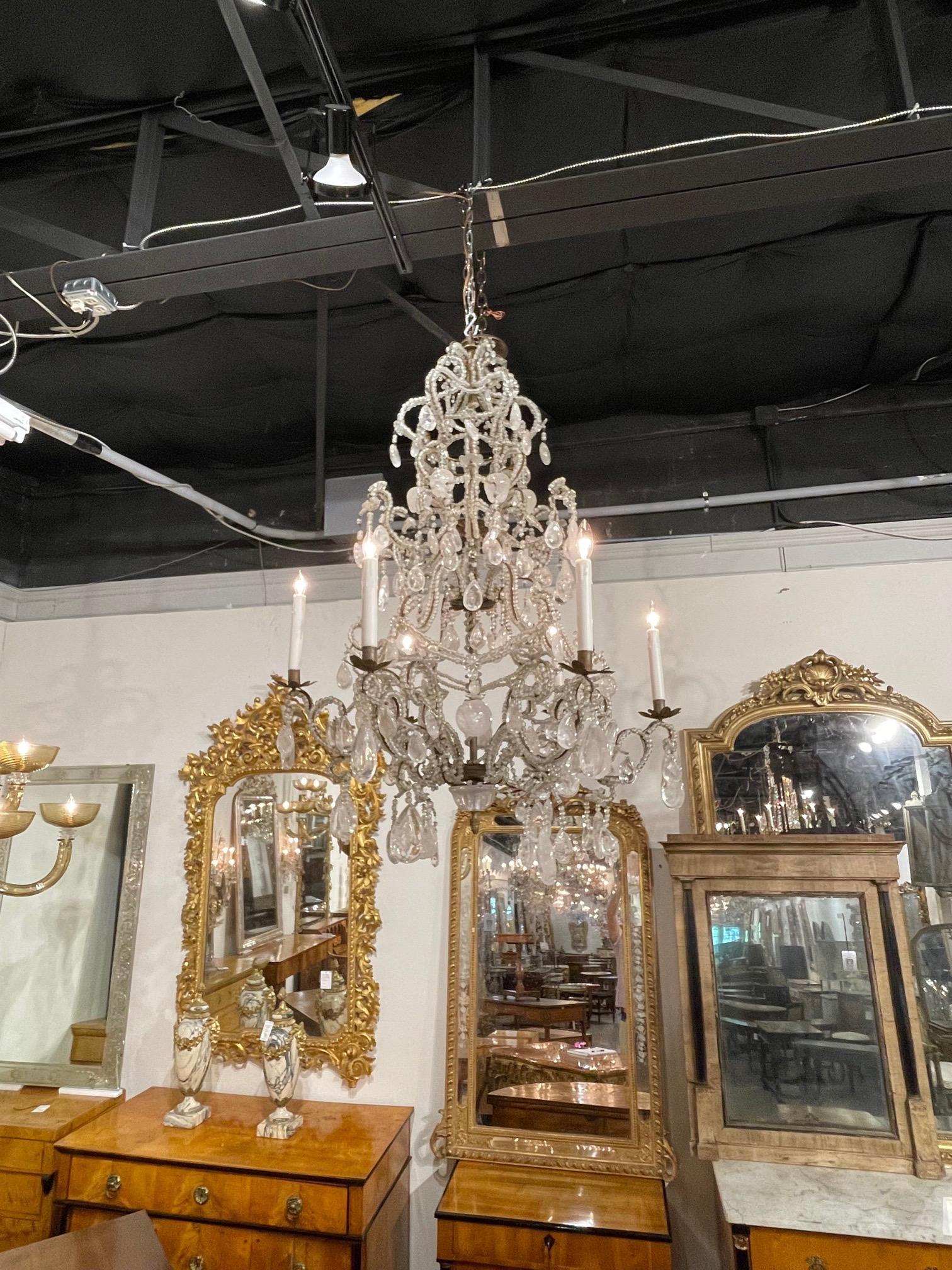 Gorgeous 19th century French rock crystal chandelier with 6 lights. Covered in lovely rock crystals and the decorative base is adorned with beads. A very elegant look!