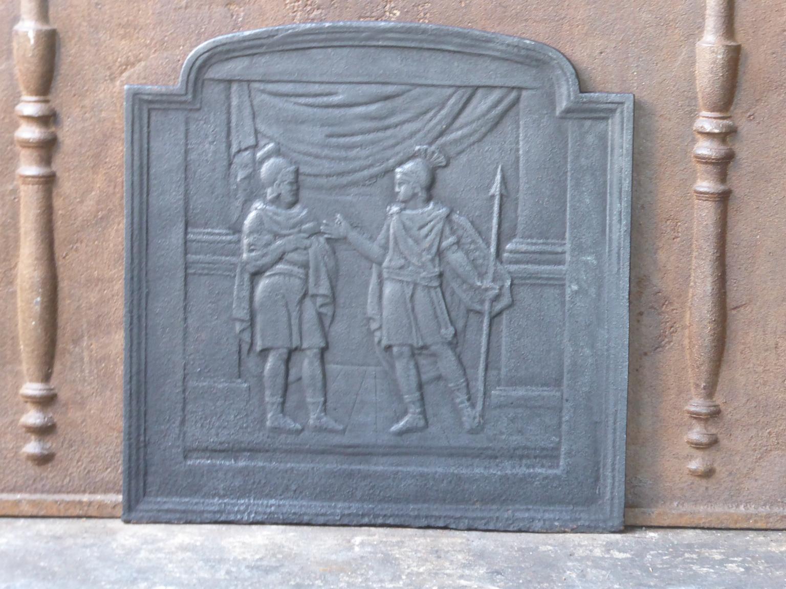 19th century French Napoleon III fireback with a Roman scene. The fireback is made of cast iron and has a black patina. It is in a good condition and does not have cracks.