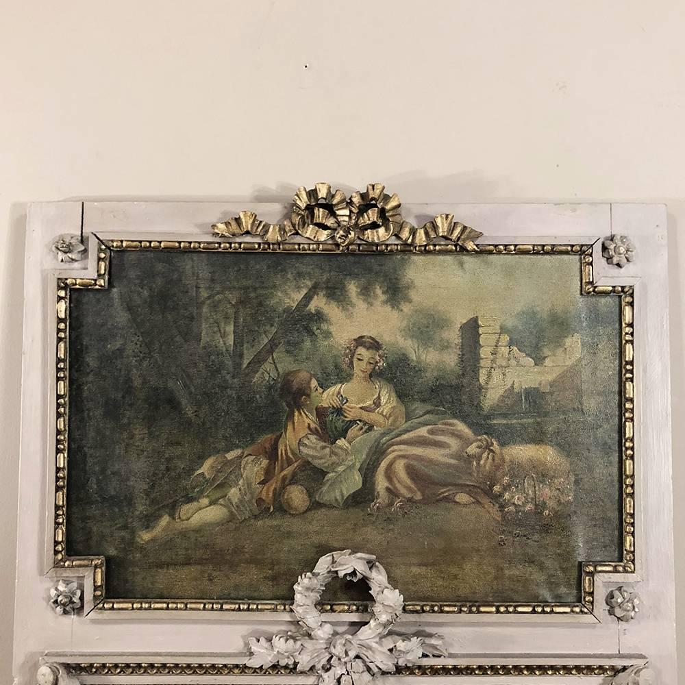 19th century French Louis XVI painted trumeau mirror represents the essence of the genre, with an opulent touch that will stand out in any room! Romantic courtship scene is played out in the garden as the subject of the painting on top, while the