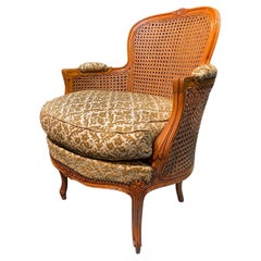 19th Century French Round Bergere Chair in Hand Carved Walnut Wood with Cane