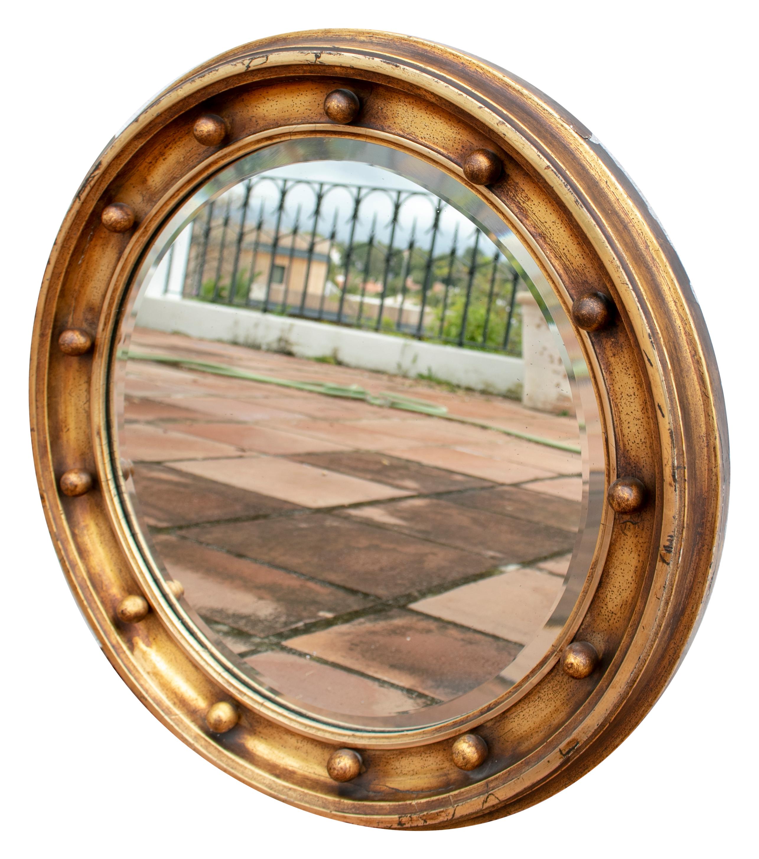 19th century French round mirror with ball decorations.