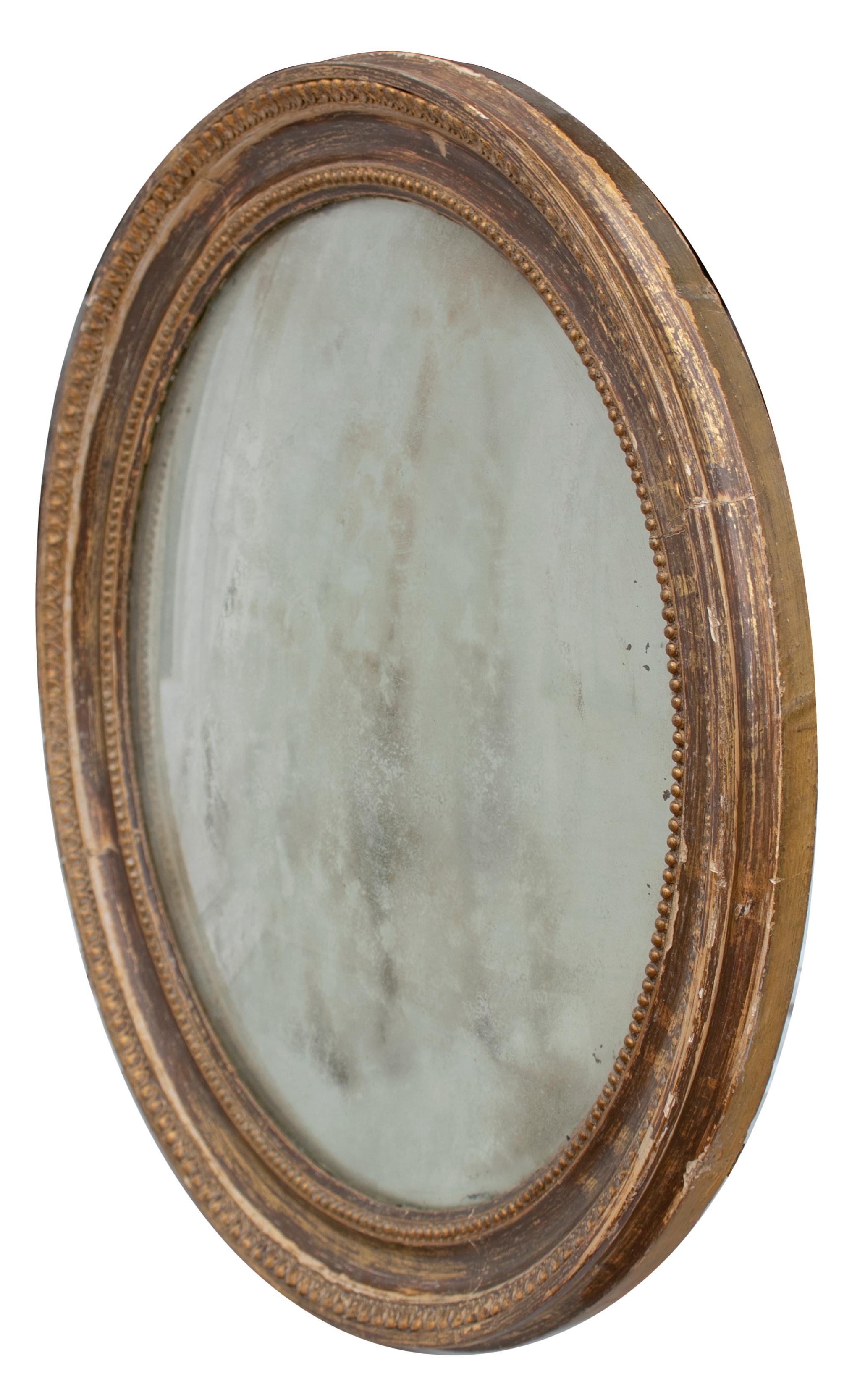 19th century French round mirror with gilt frame.