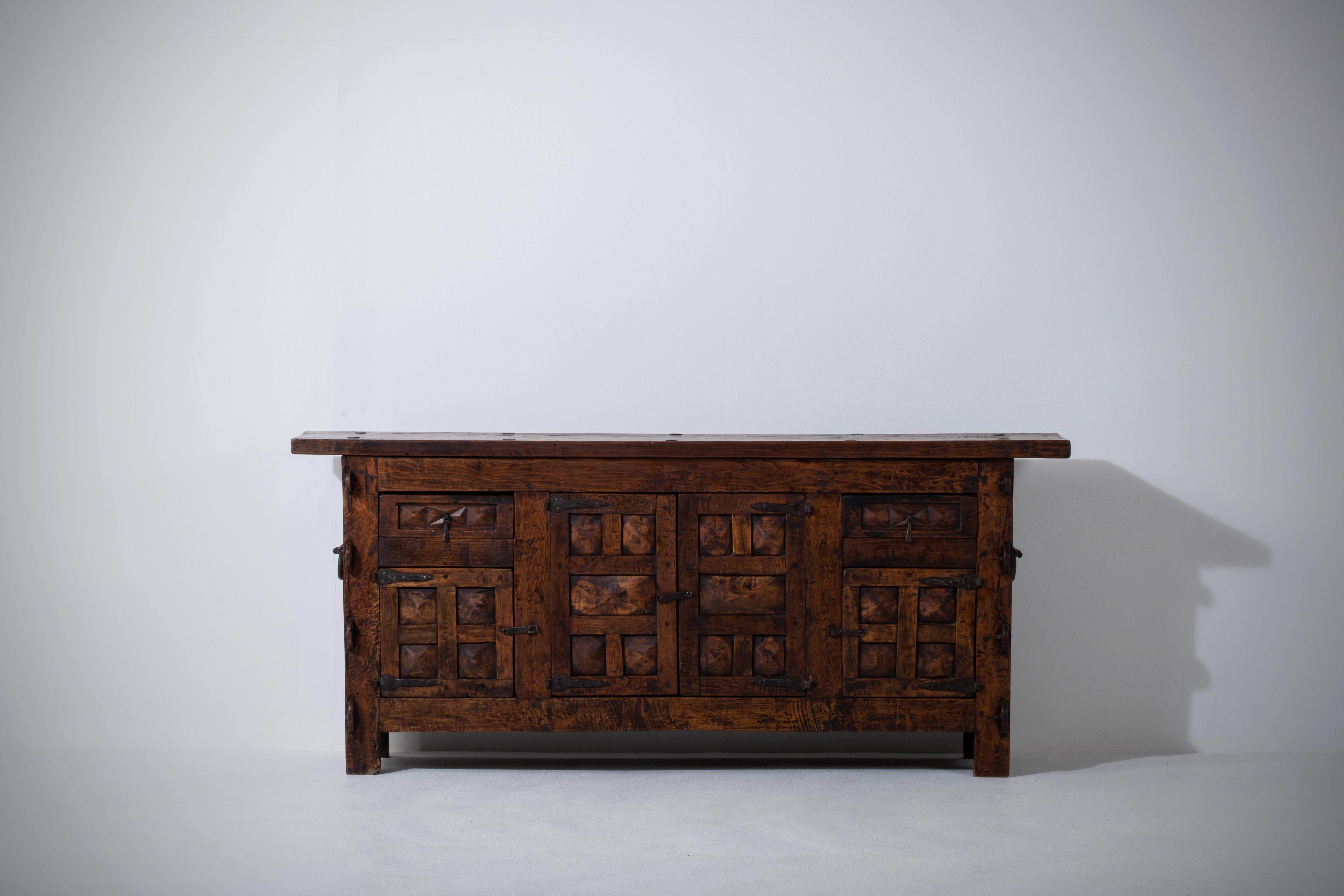 Rustic Armoire in solid oak, France, 18th century.
This old buffet was unearthed in a farm in the Vosges, it is an authentic piece of rustic furniture. Handcrafted in the 1800s, made from raw wooden planks.
Nice Brutalist object, wabi-sabi spirit.