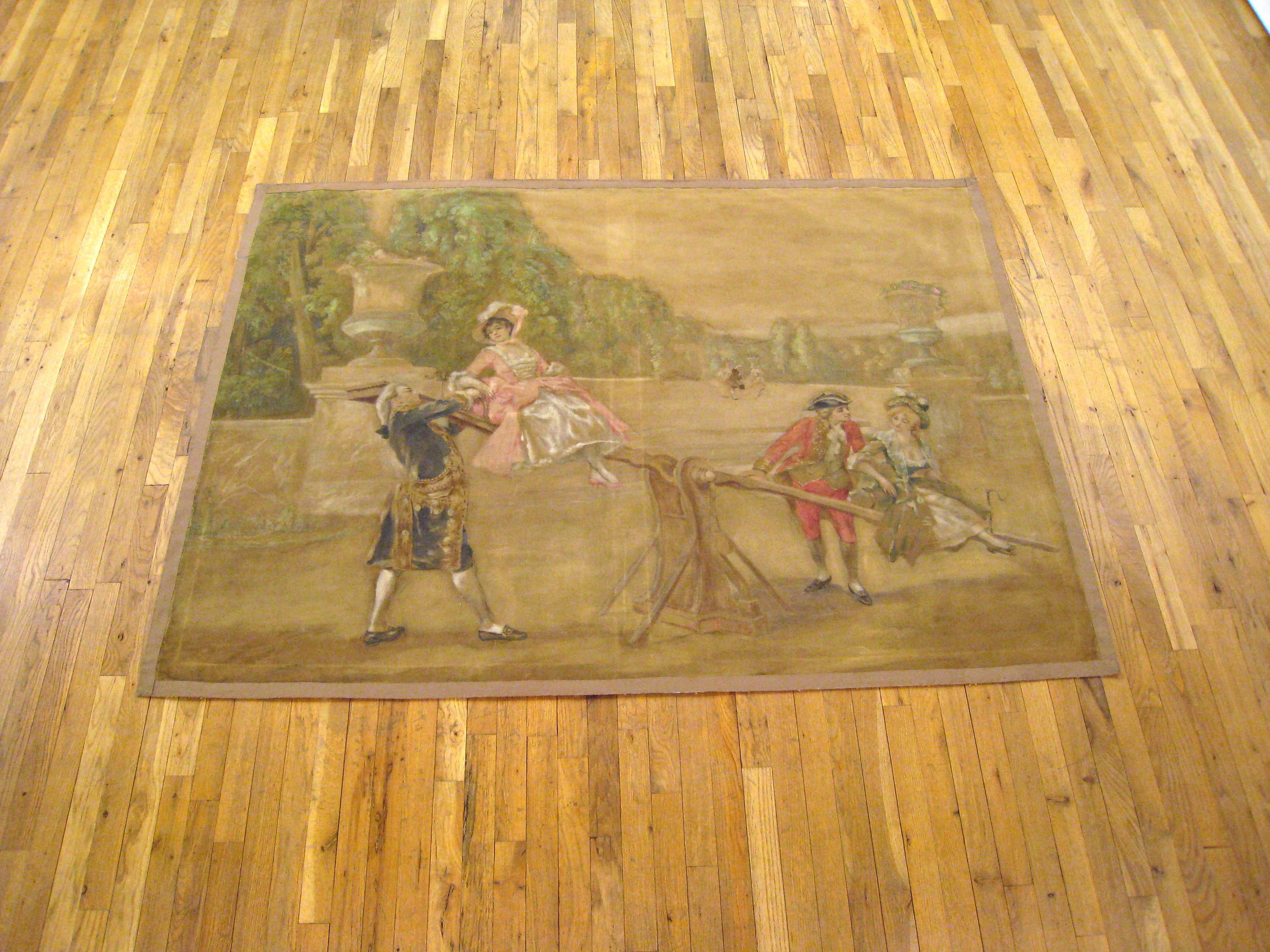 A French painted tapestry cartoon from the 19th century featuring a romantic and charming scene with two noble men playing with their ladies on a swing in a jardin à la française (French formal garden). This cartoon was probably used to wove a