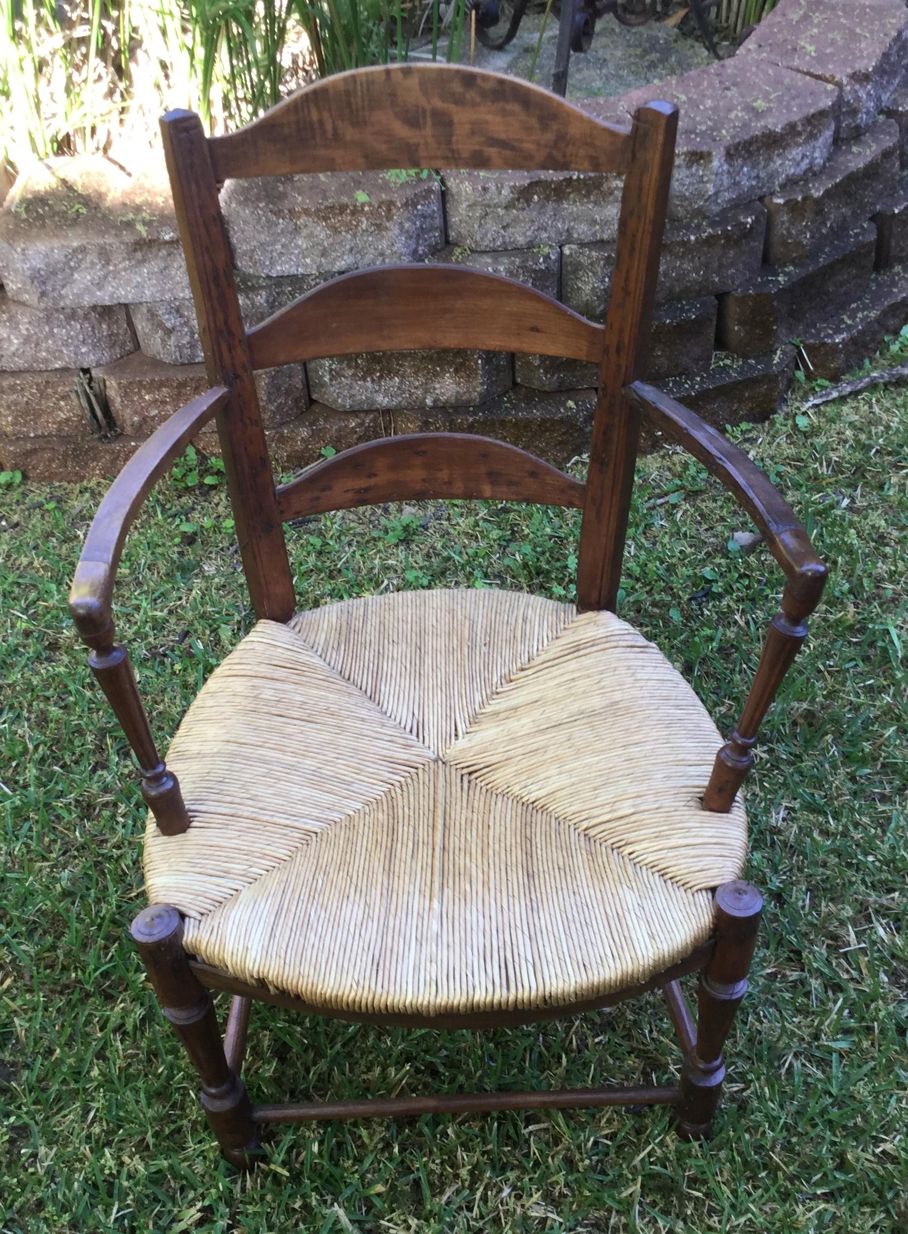 19th century French Rustic wood armchair with a straw seat from Normandy.