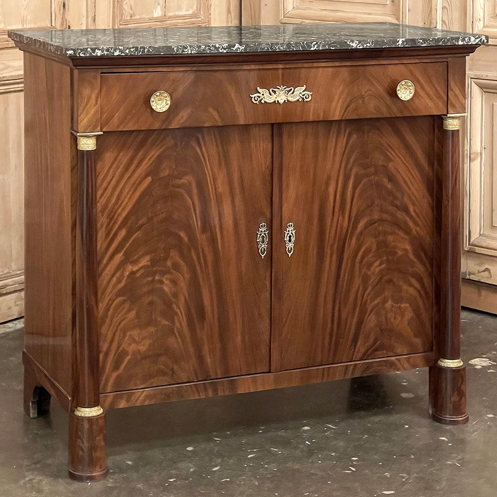 19th Century French Second Empire Period marble top buffet is a timeless example of the magnificent furnishings that emanated from France during the reign of Napoleon III. Using exotic imported mahogany, flame pattern veneering adorns the entire