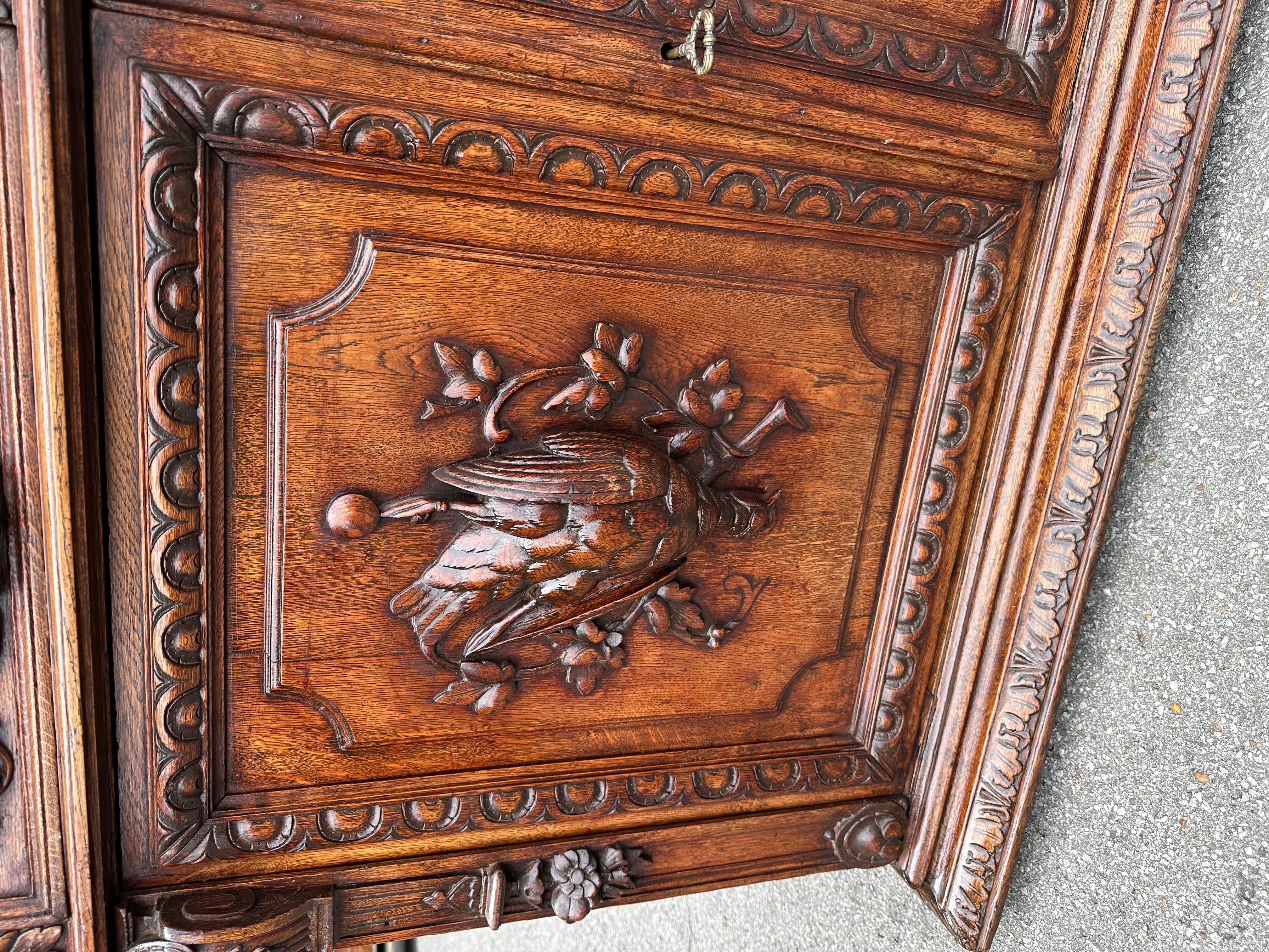 This is an absolutely stunning server the carving is so delicate and precise depicting a pair of pheasants from the days hunt. The patina is so beautiful on this server With a beautiful French polish.