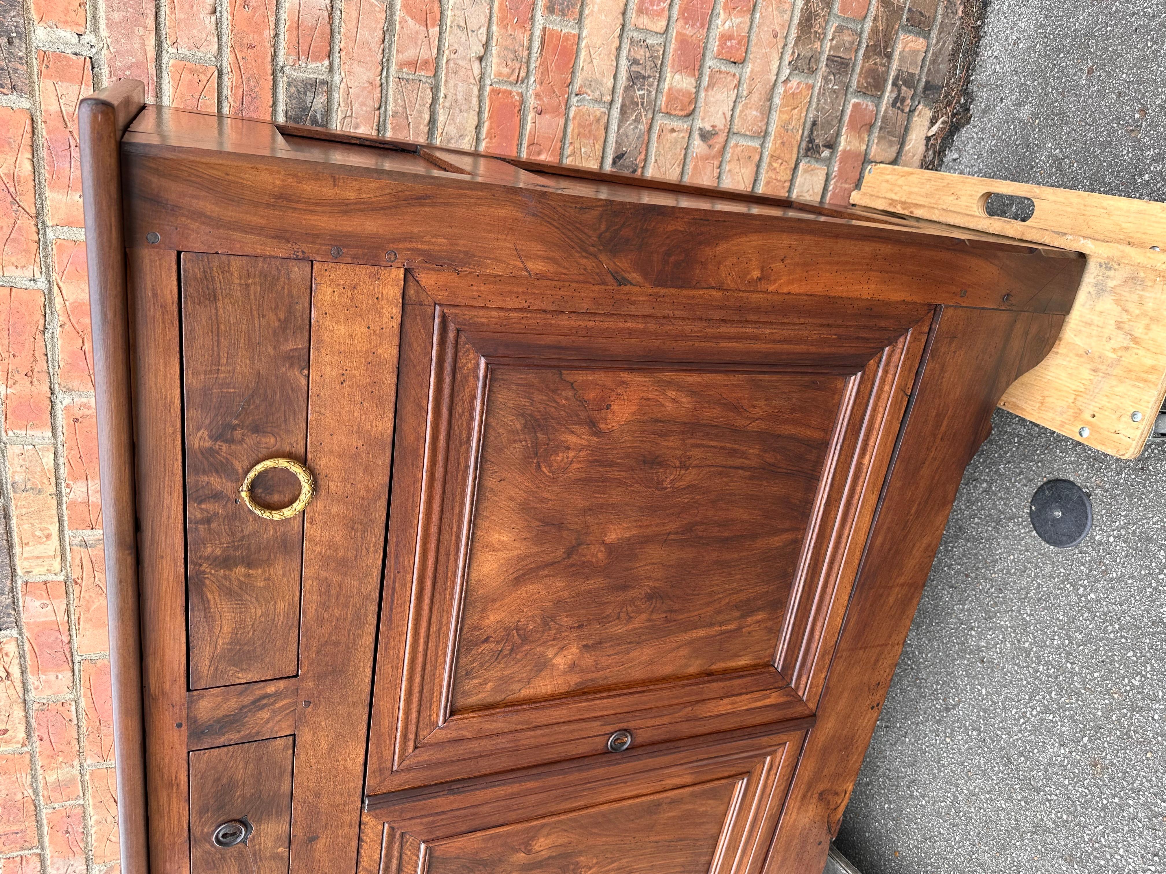 Notice the shallow depth of 16 inches, this is a very unique French server from the mid 19th century in walnut which gives it such a nice warm brown tone. A clean and simple design with two drawers over two doors that both open to ample amount of