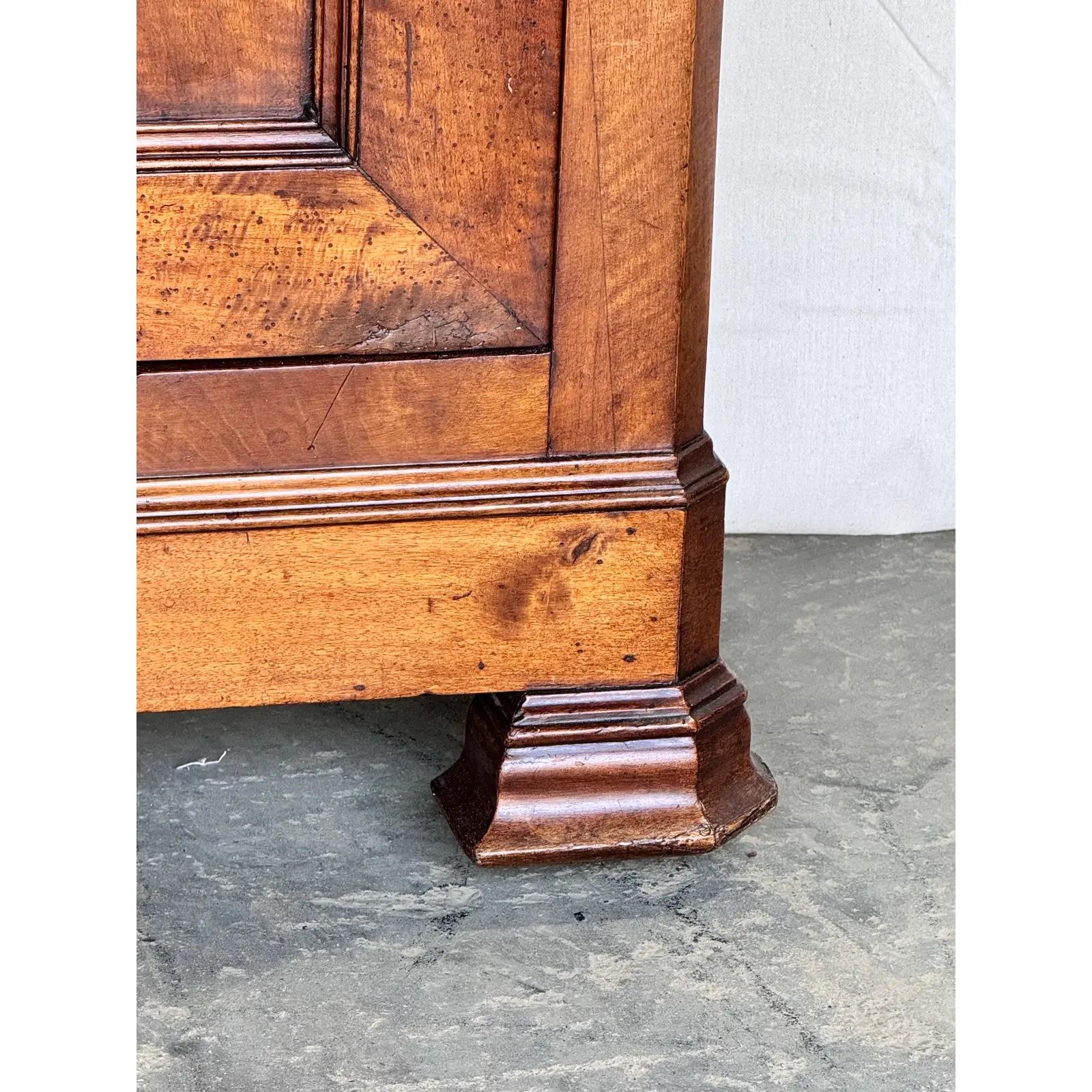 Notice the shallow depth of 16 inches, this is a very unique French server from the early 19th century in walnut which gives it such a nice warm brown tone. A clean and simple design with two drawers over two doors that both open to ample amount of